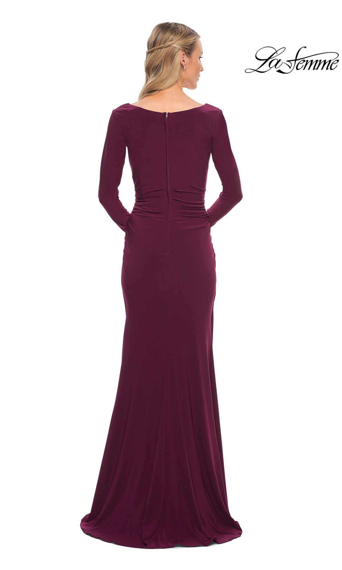 Back view of a woman wearing the Long Formal Dress: La Femme 29924, a long-sleeved, dark burgundy jersey gown with a ruched waist, v-neckline, and center back zipper.