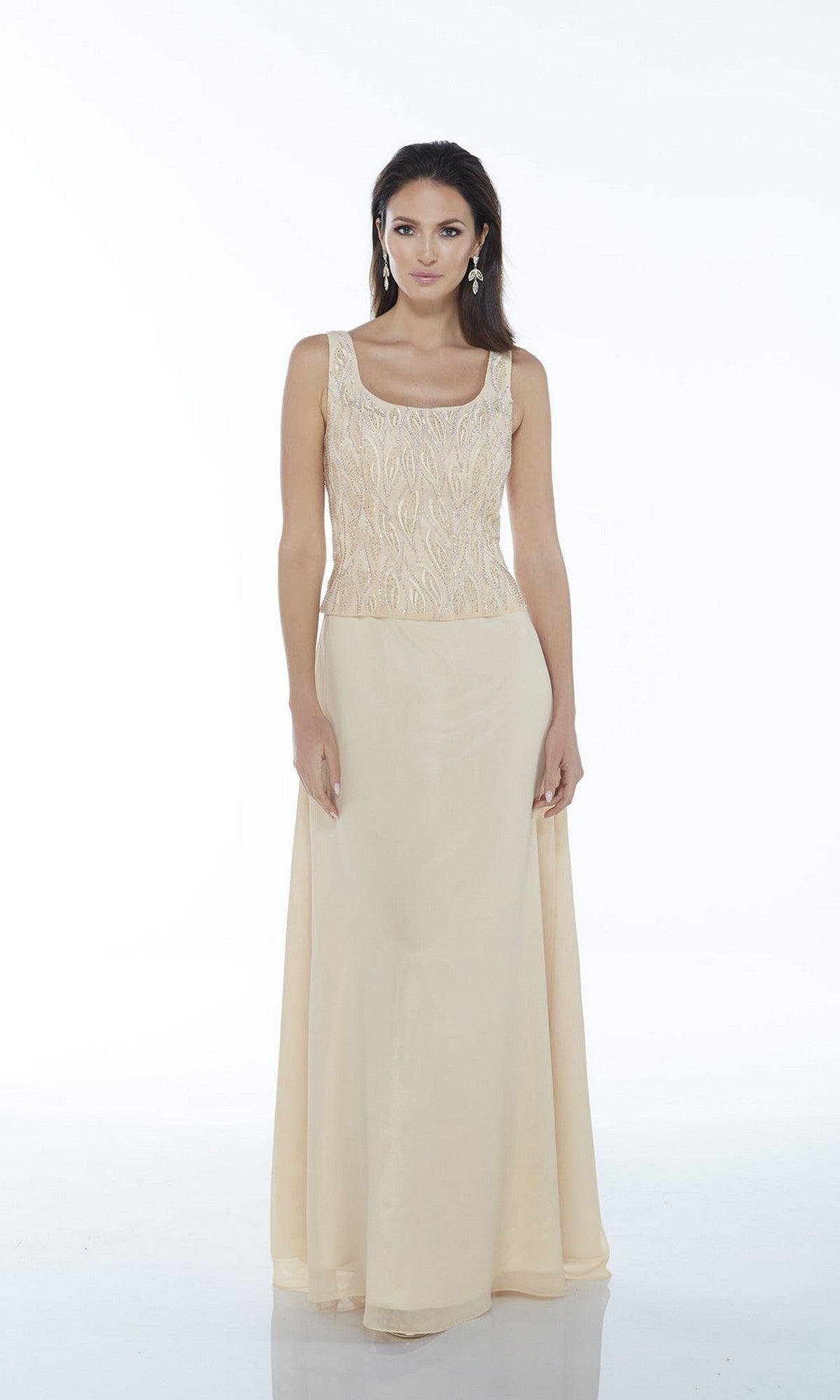 A woman models the Alyce 29953 long formal dress, featuring a sleeveless, beaded bodice and plain light beige skirt, shown against a white background.