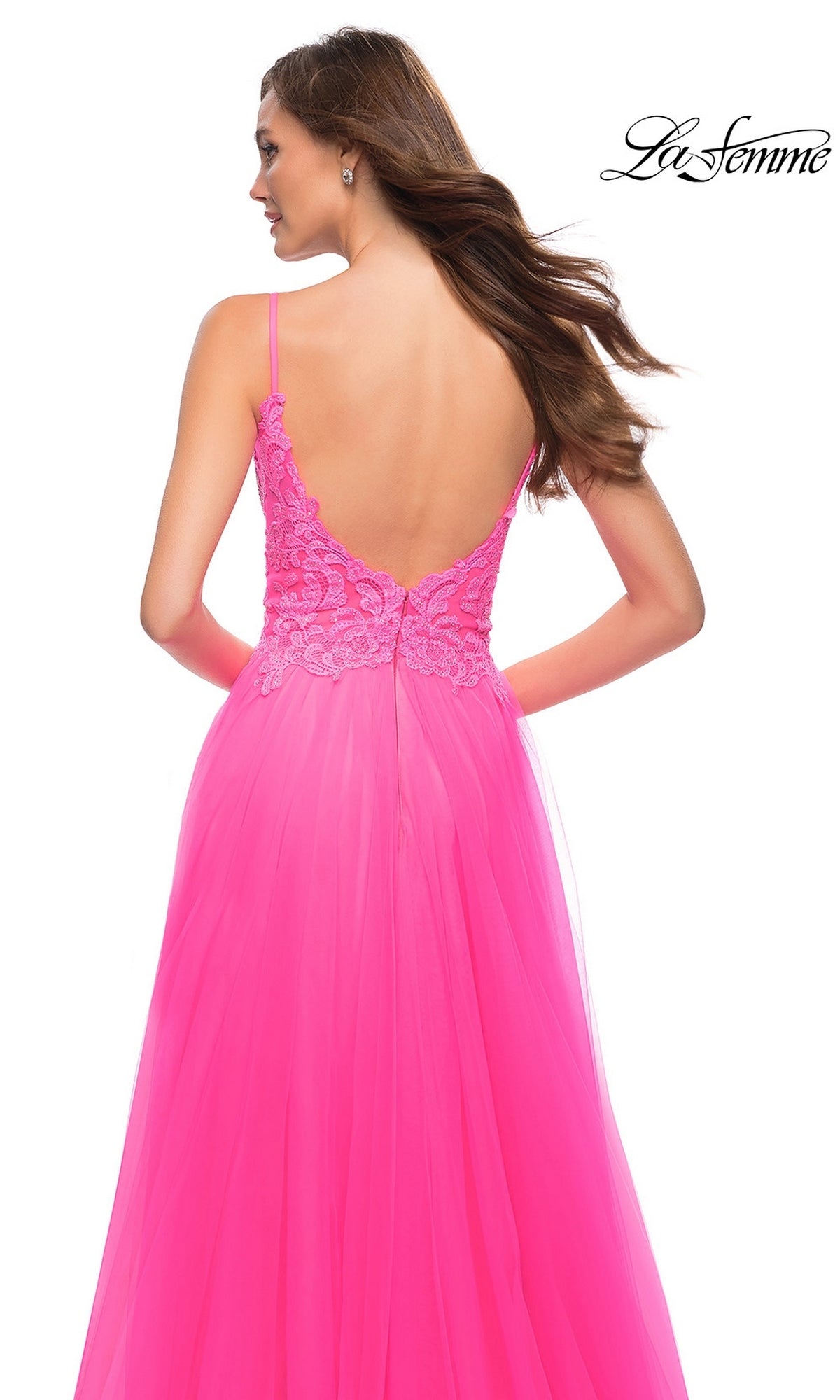 Back view of a neon pink La Femme 29964 A-line prom dress with a sleeveless, floor-length silhouette, a deep V-back, and a lace bodice.