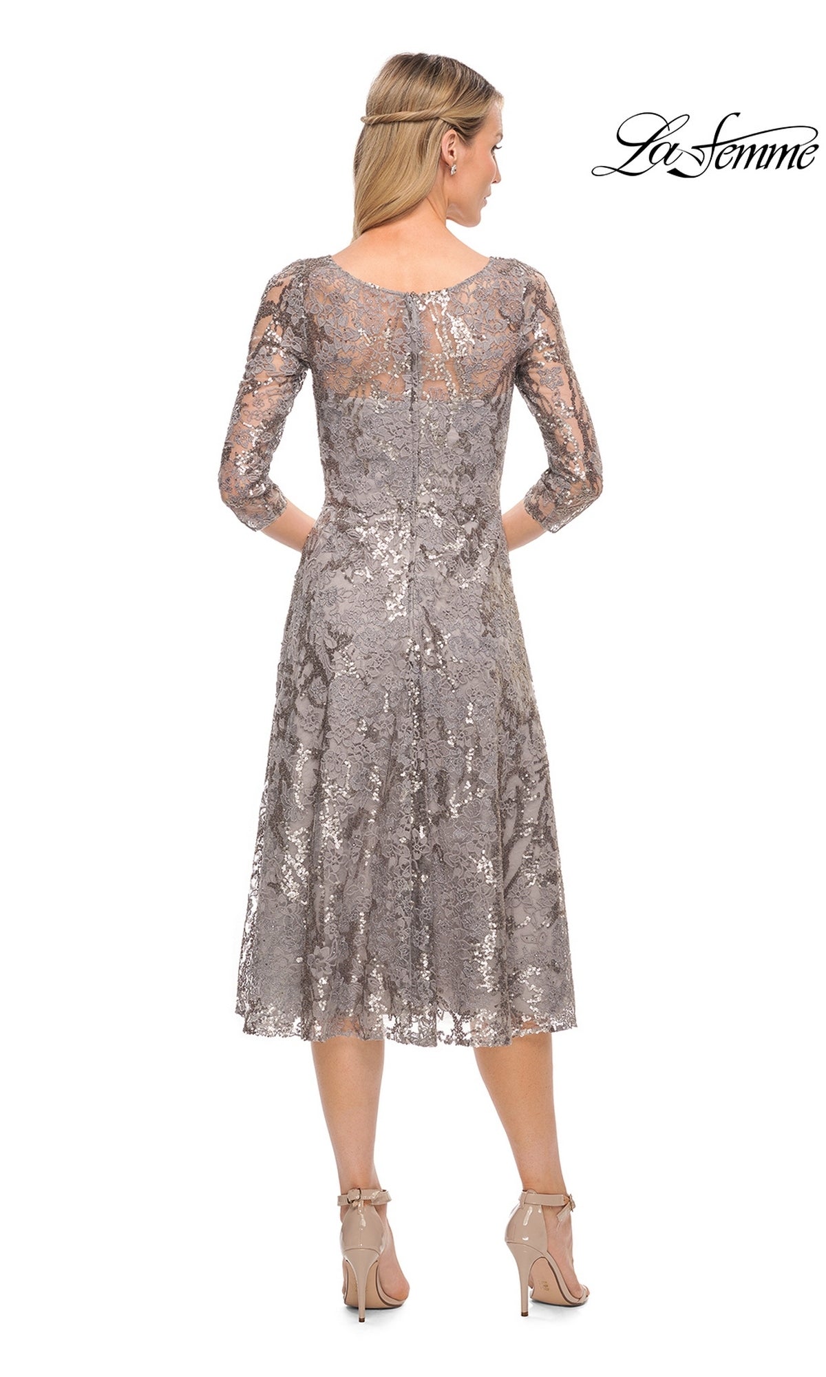 Back view of a woman wearing a metallic lace Midi Wedding Guest Dress: La Femme 29993 with three-quarter sleeves and beige heels.