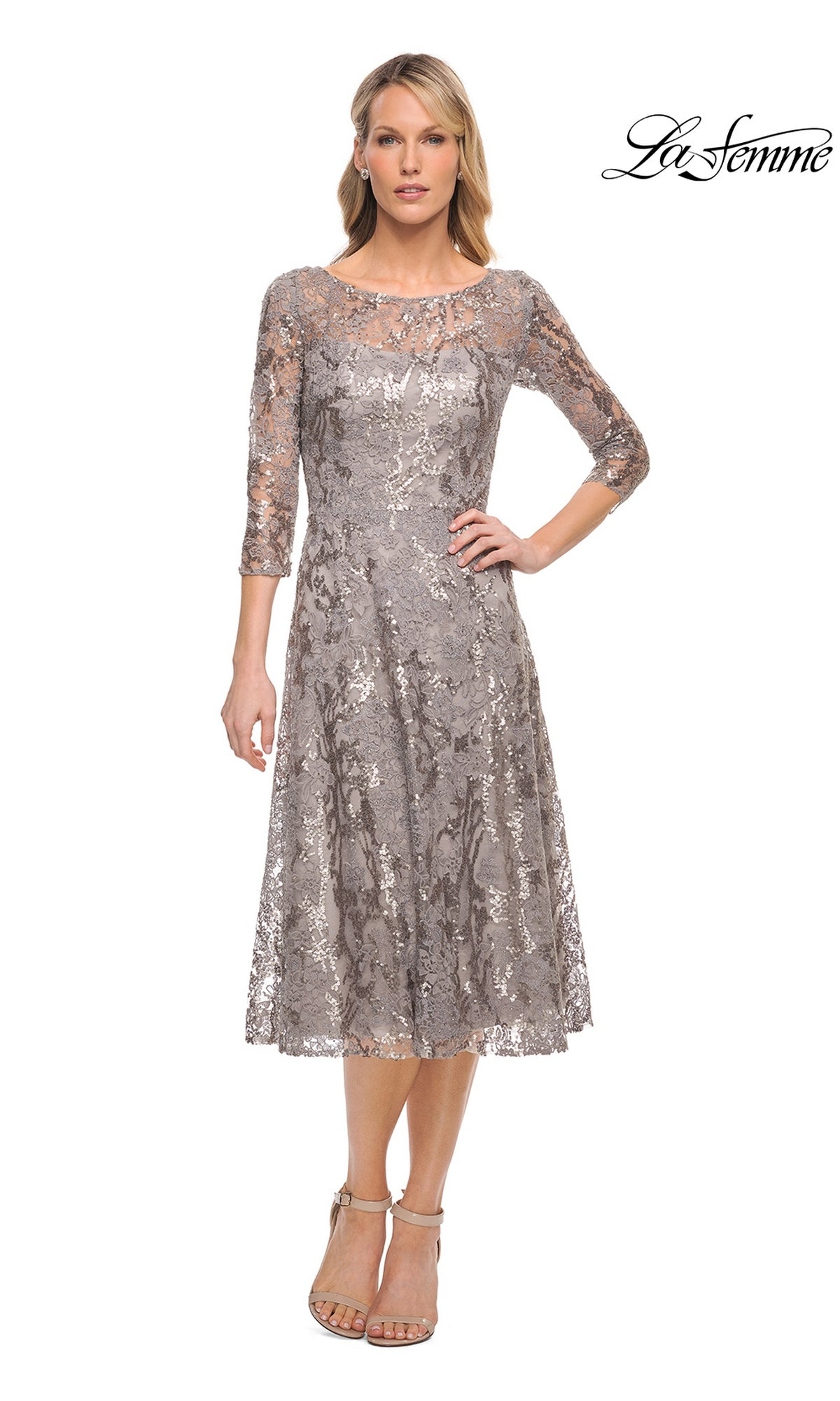 A woman wears a taupe, three-quarter sleeve metallic lace Midi Wedding Guest Dress: La Femme 29993, featuring a bateau neckline.
