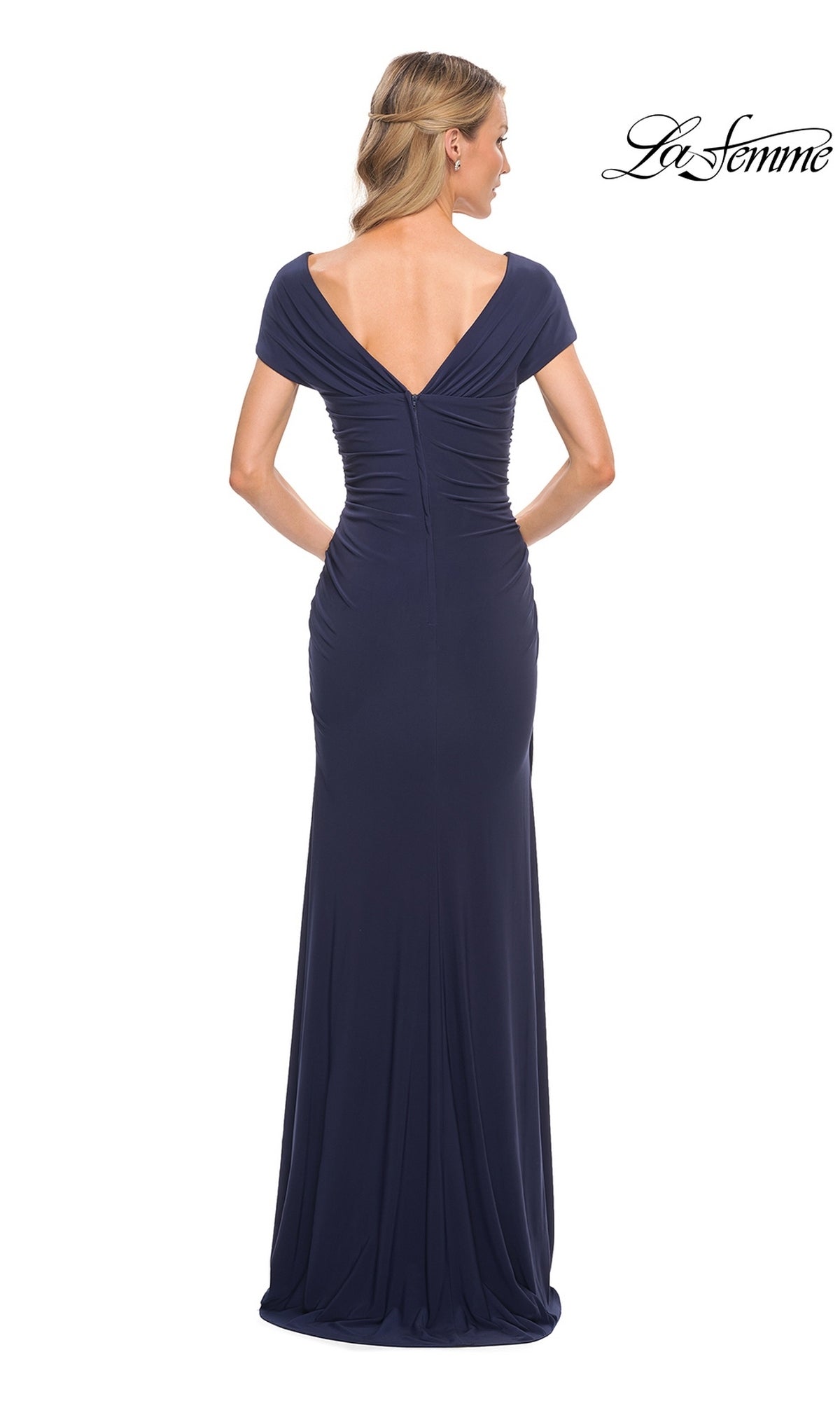 Back view of a woman wearing a navy Long Formal Dress: La Femme 29998, featuring short off-the-shoulder sleeves, a V-back, and a fitted sheath skirt.