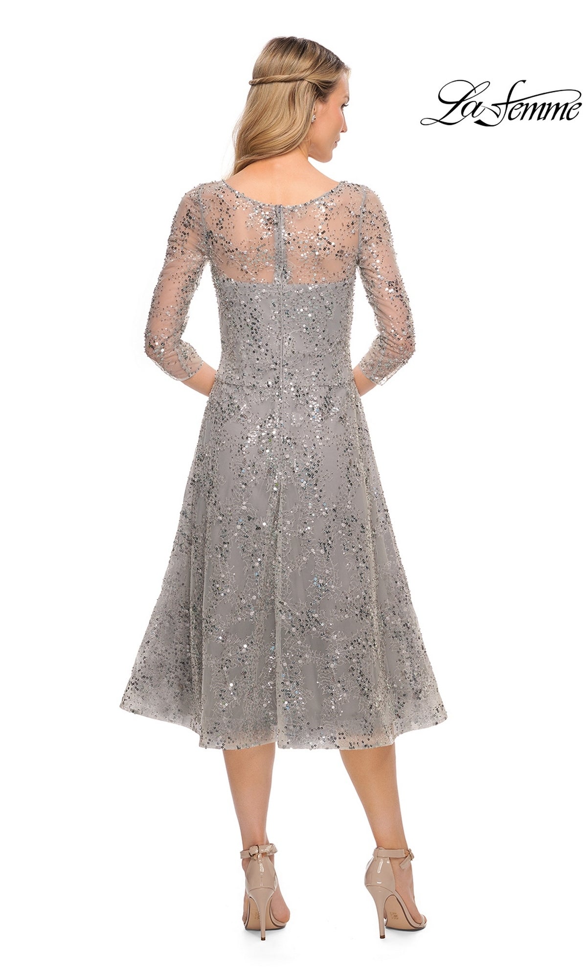 Back view of the grey, sequin-embellished Midi Mother of Bride Dress: La Femme 30002 in a fit-and-flare silhouette with three-quarter sleeves and nude heels.