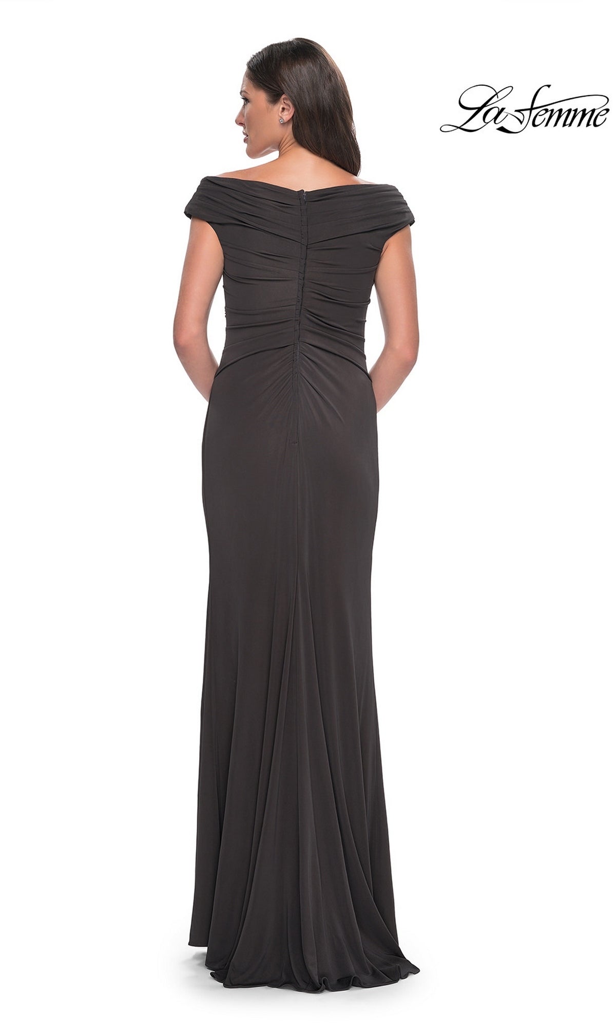 A woman faces away in a floor-length, off-the-shoulder v-neck black Long Formal Dress: La Femme 30040, showing the ruched back and zipper. The “La Femme” logo is at top right.