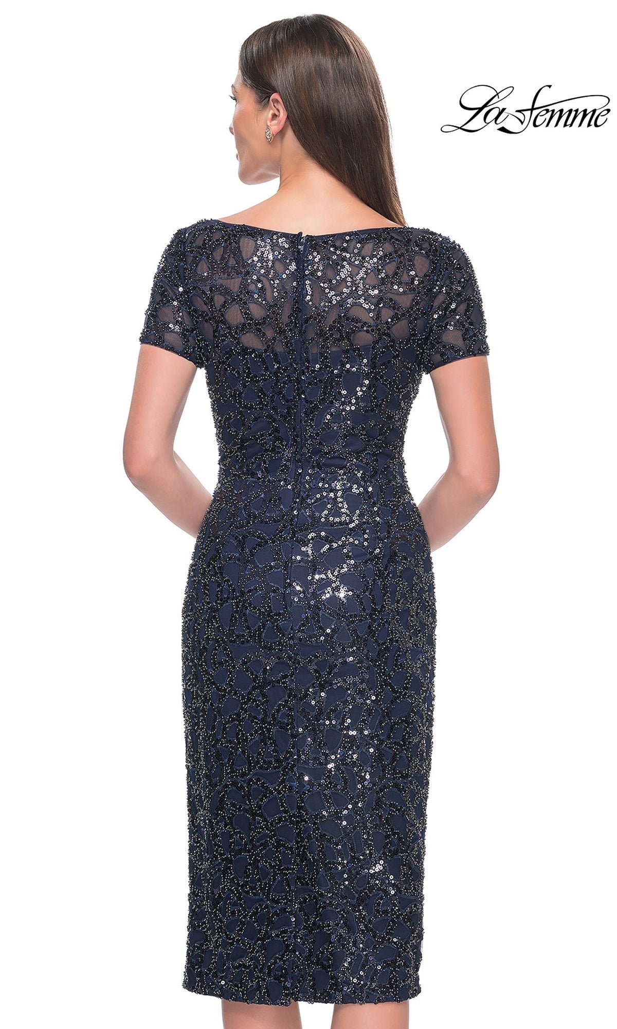 Back view of the Knee Length Wedding Guest Dress: La Femme 30043, a navy knee-length sequin sheath dress with short sleeves and an all-over pattern.
