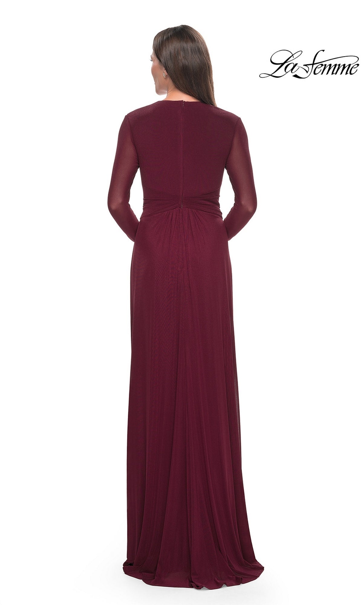 Back view of a person wearing a Long Formal Dress: La Femme 30048, a floor-length burgundy jersey dress with long sleeves and a gathered waist.