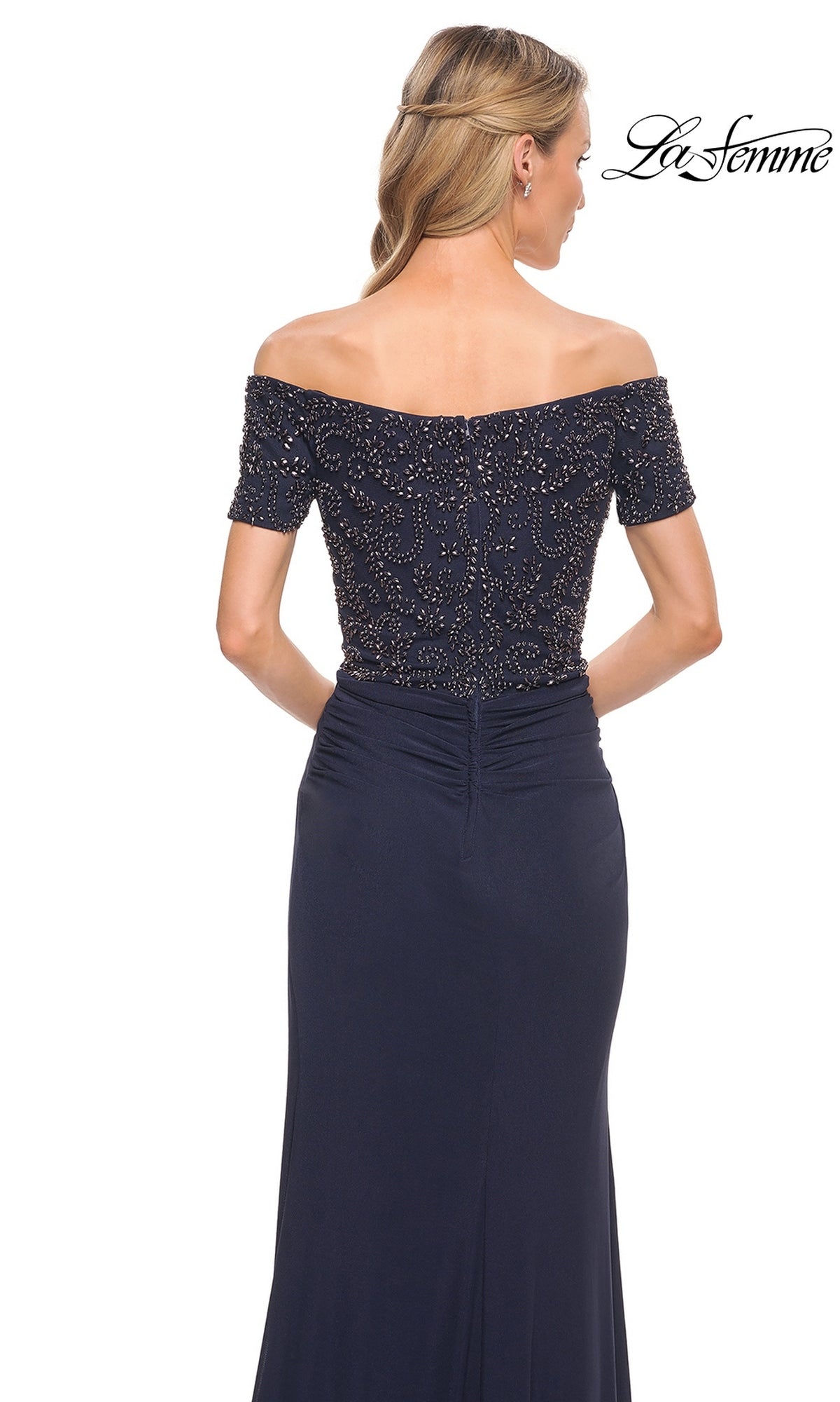 Woman seen from the back in Long Formal Dress: La Femme 30057, with off-the-shoulder beaded bodice. “La Femme” logo is in the top right corner.
