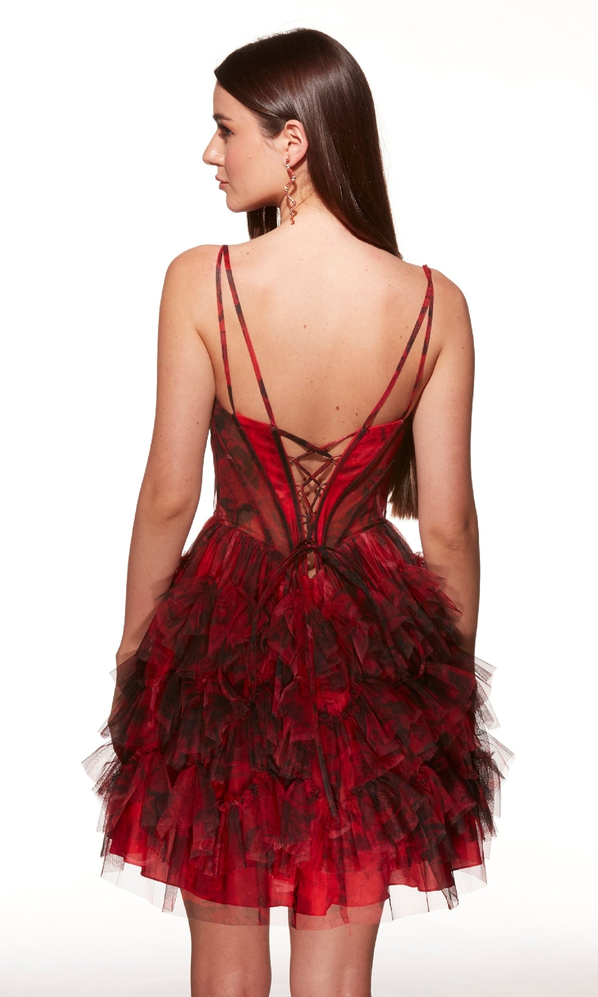 Woman facing away, wearing the Short Print Fit-and-Flare Hoco Dress Alyce 30078 with ruffles, a lace-up back, and thin straps.