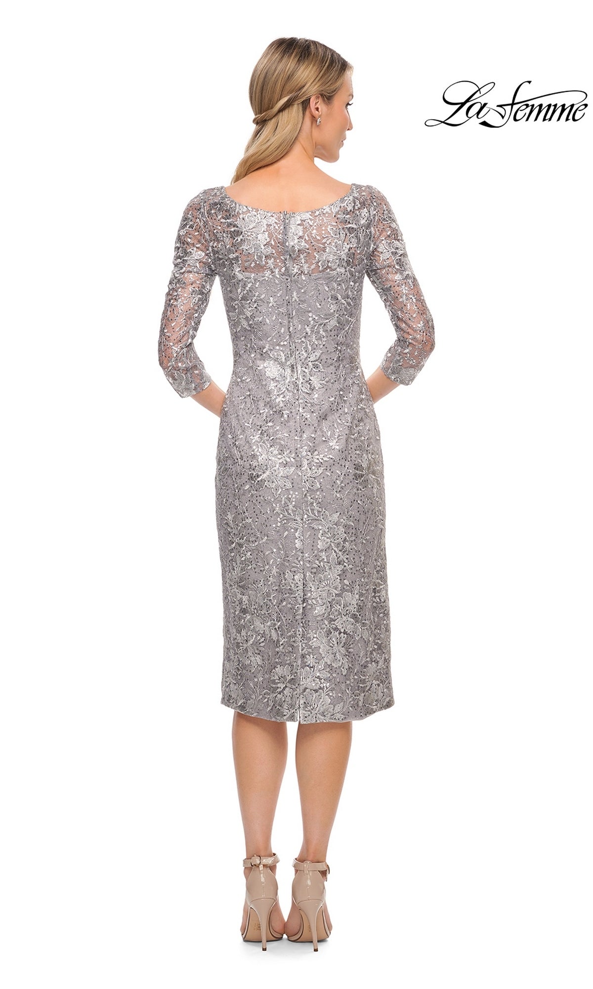 Back view of a woman in a silver Midi Wedding Guest Dress: La Femme 30097 featuring a sheath silhouette, three-quarter sleeves, and beige high heels.