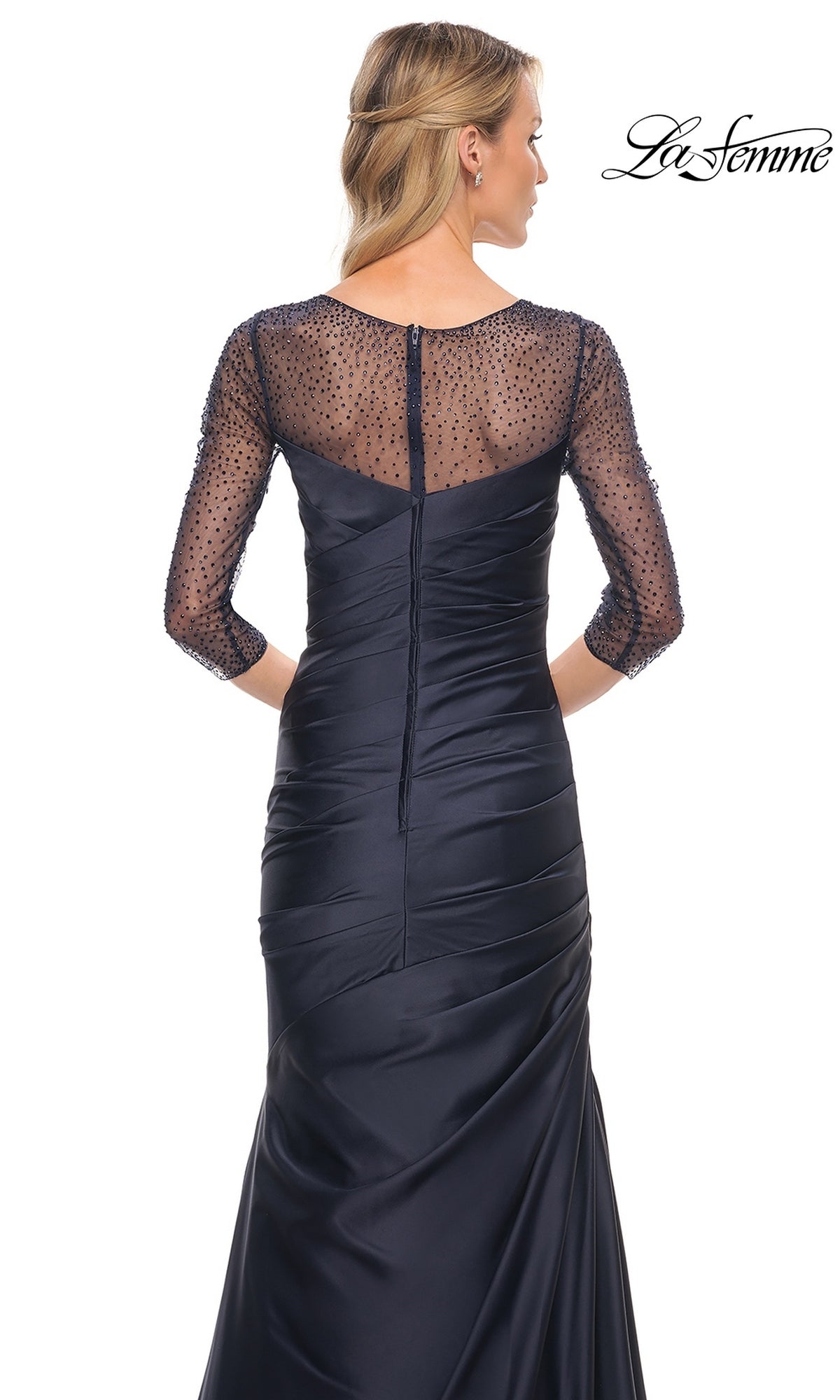Back view of the Long Formal Dress: La Femme 30138, a floor-length navy satin gown featuring a sheer, beaded three-quarter sleeve bodice and a ruched mermaid skirt.