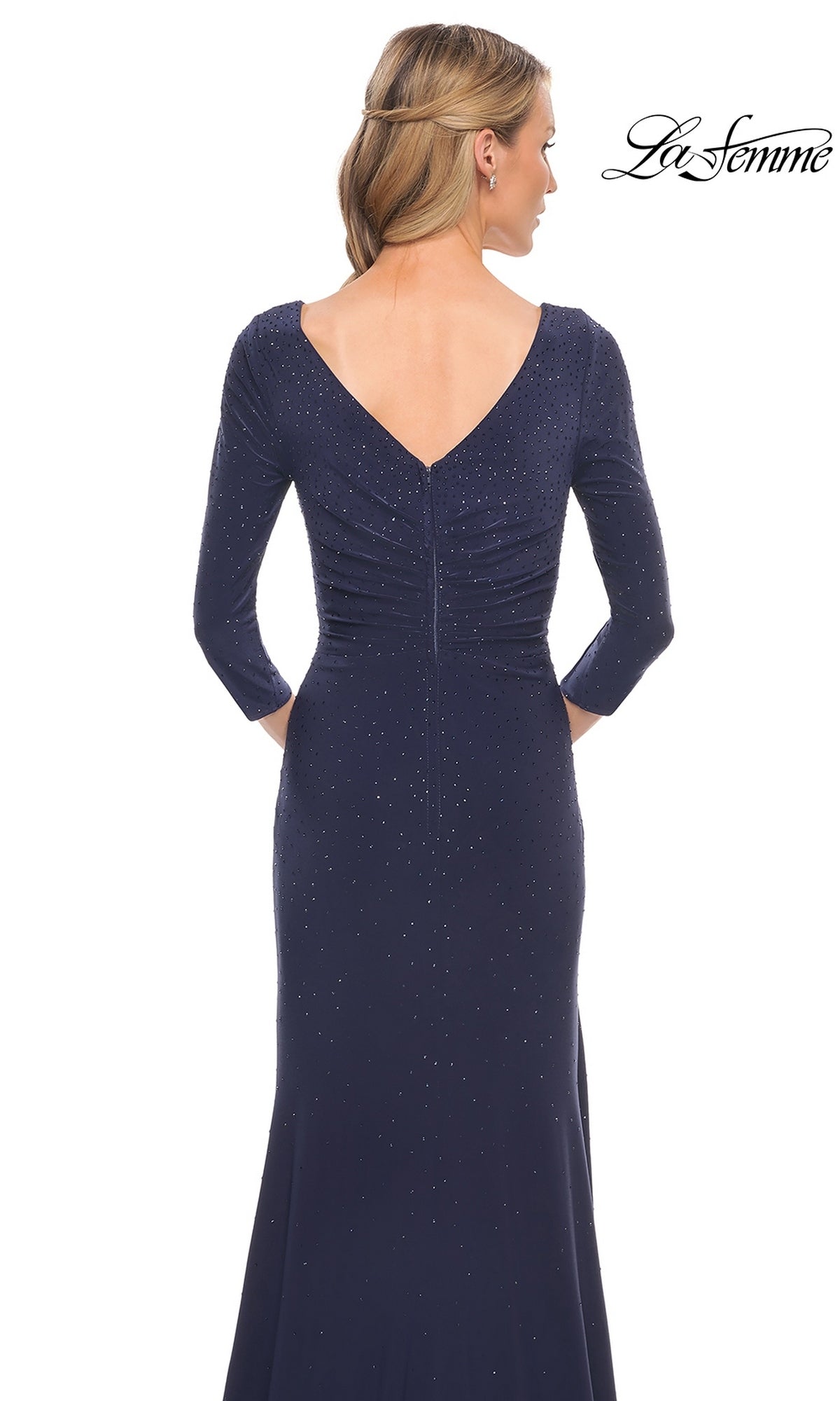 Back view of the Long Formal Dress: La Femme 30177, a floor-length navy gown featuring three-quarter sleeves, a V-neckline, and subtle sparkling embellishments.
