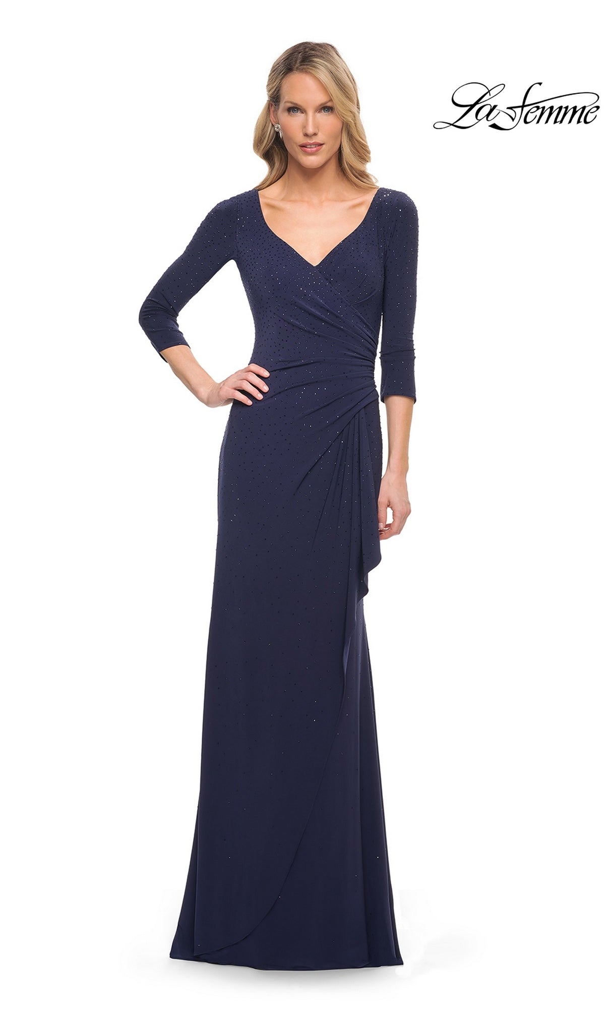 A woman wearing a navy Long Formal Dress: La Femme 30177, featuring a floor-length V-neck design with three-quarter sleeves and subtle embellishments.