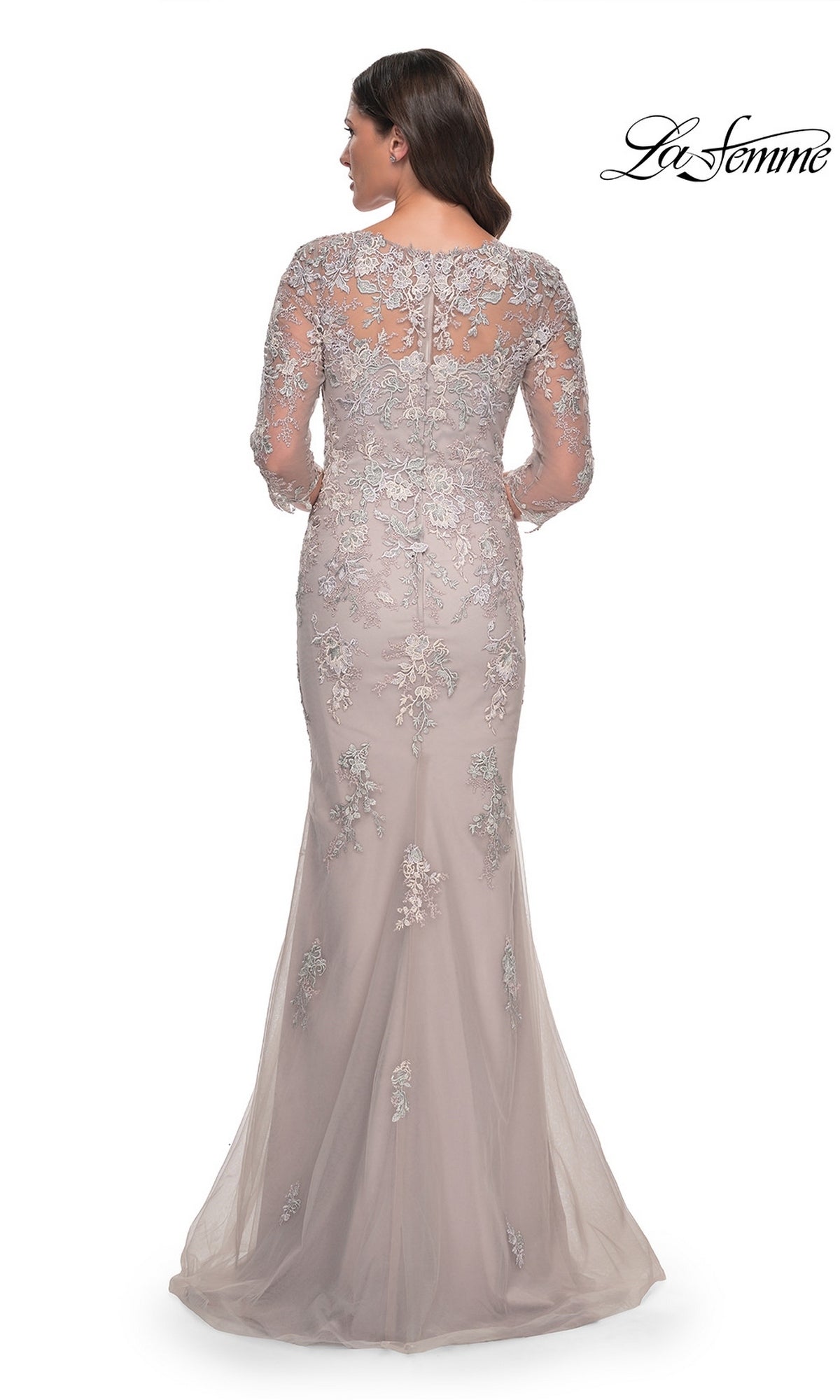 A woman seen from behind wearing a La Femme 30200 long formal dress in dusty lilac, featuring a sheer lace bodice and a flared mermaid skirt.