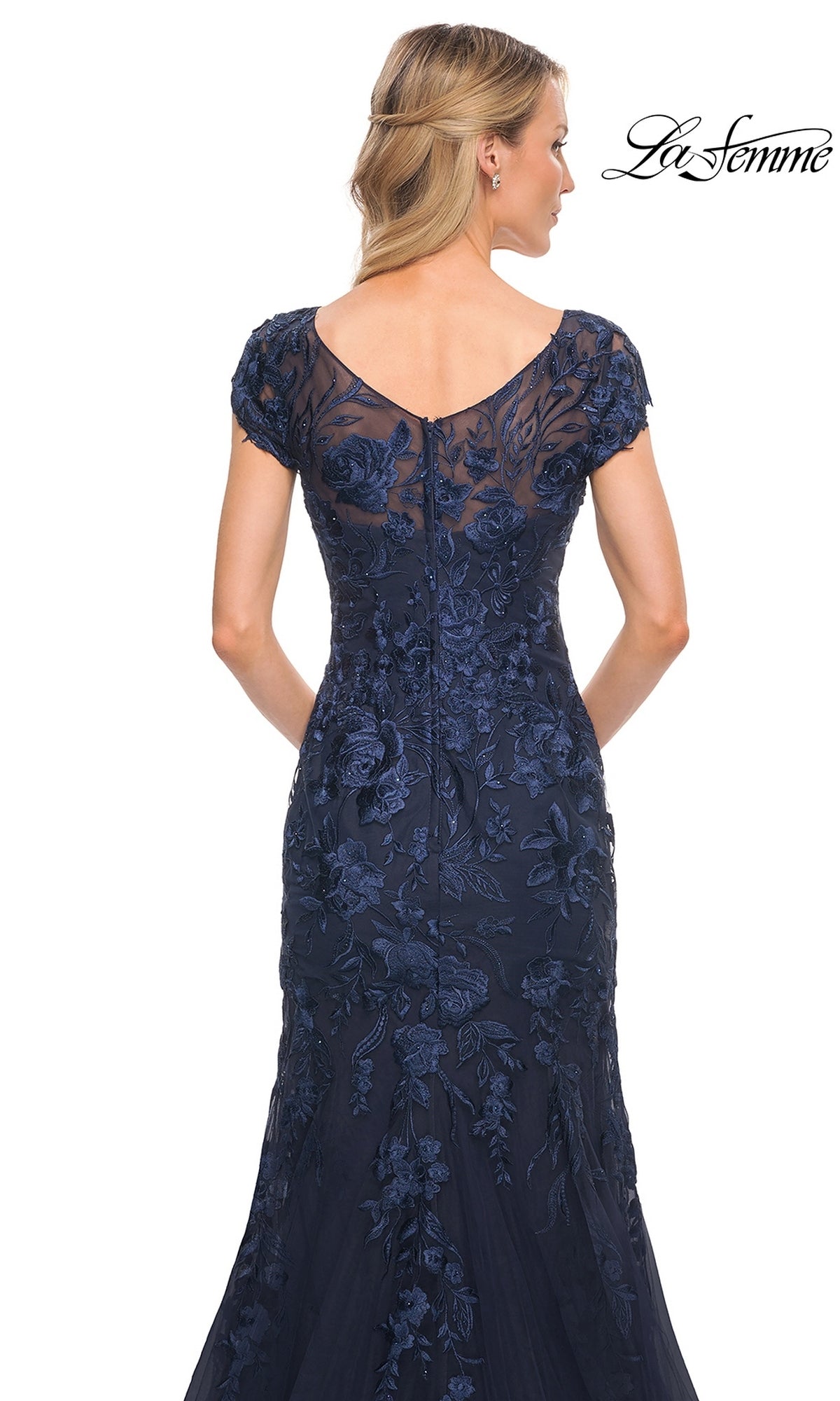 Back view of the Long Formal Dress: La Femme 30269, a floor-length navy blue mermaid silhouette dress with a V-neckline, cap sleeves, and floral embroidery overlay.