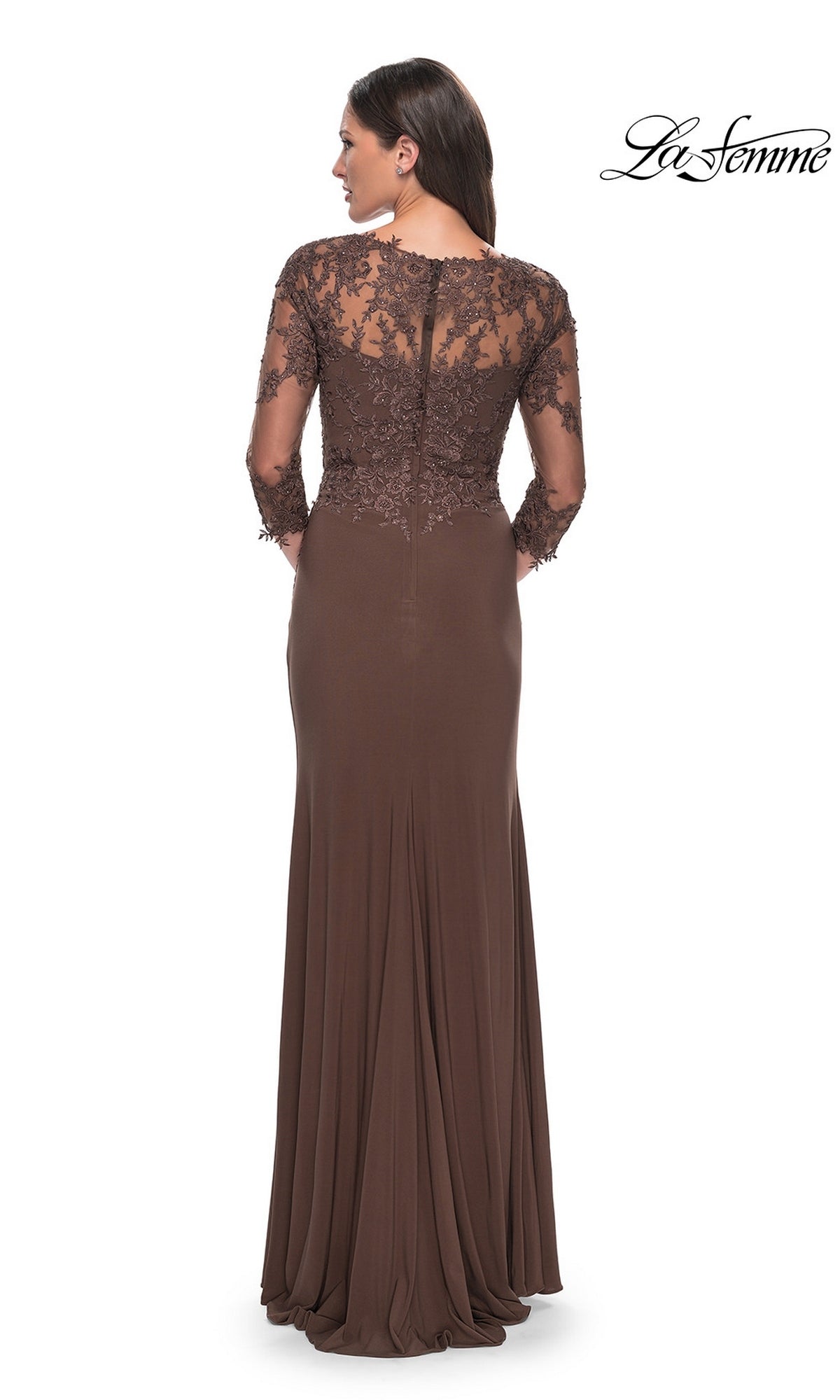 Woman wearing the Long Formal Dress: La Femme 30384, a floor-length brown gown with sheer lace long sleeves and upper back, standing with her back to the camera.