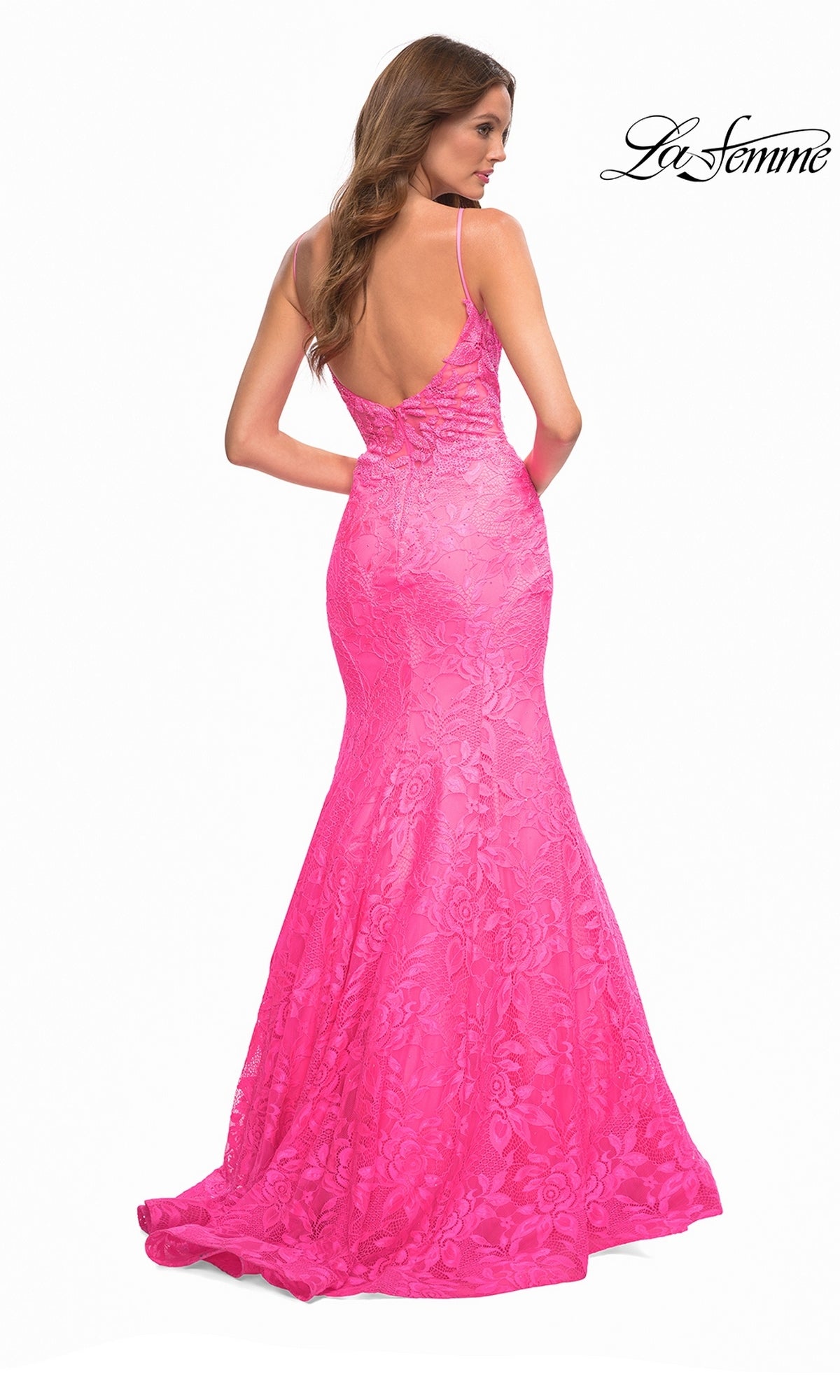 A back view of the La Femme 30663 long prom dress, a floor-length hot pink floral lace gown featuring spaghetti straps and an open back.