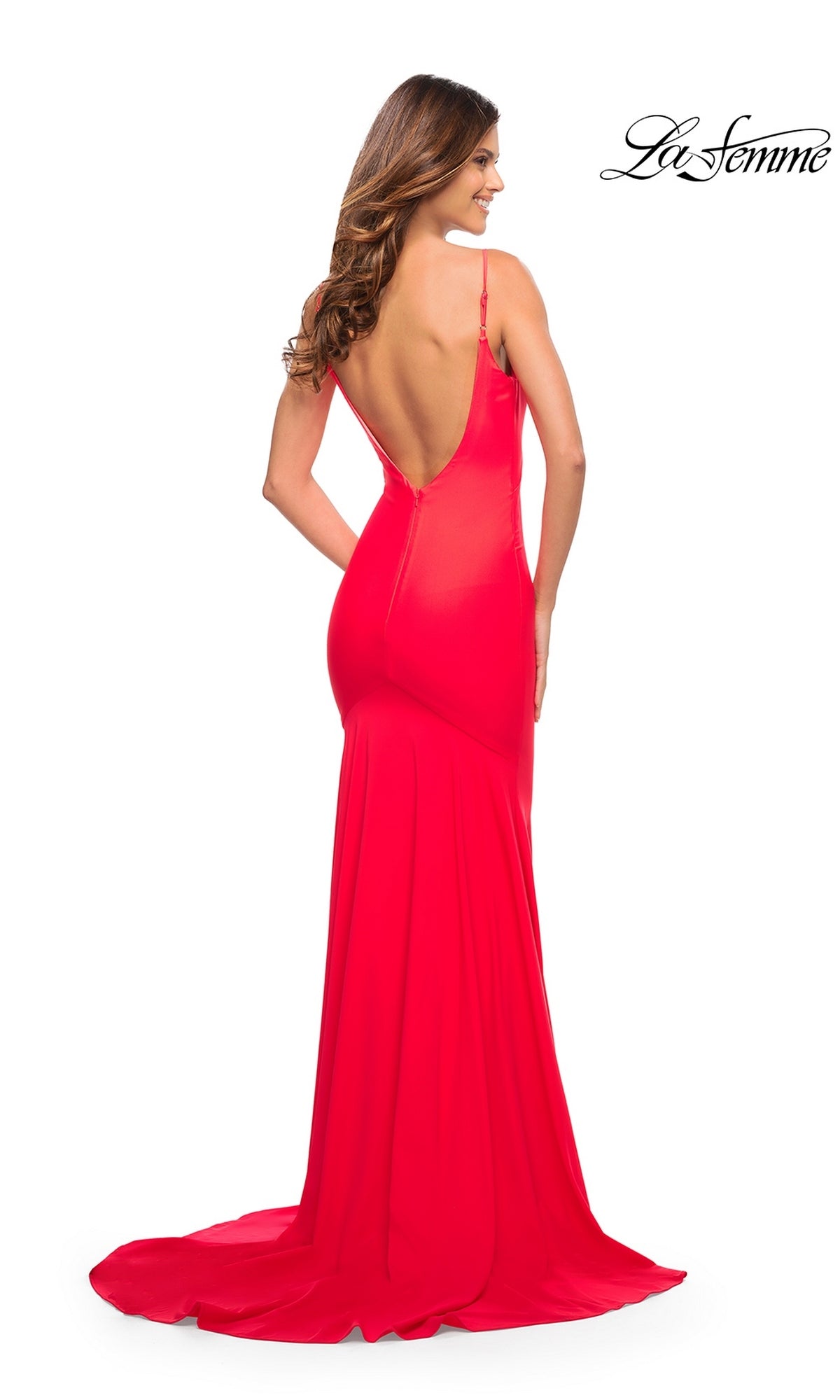 A woman seen from behind in the Long Prom Dress: La Femme 30682, a red, floor-length trumpet silhouette gown with a low open back and spaghetti straps.