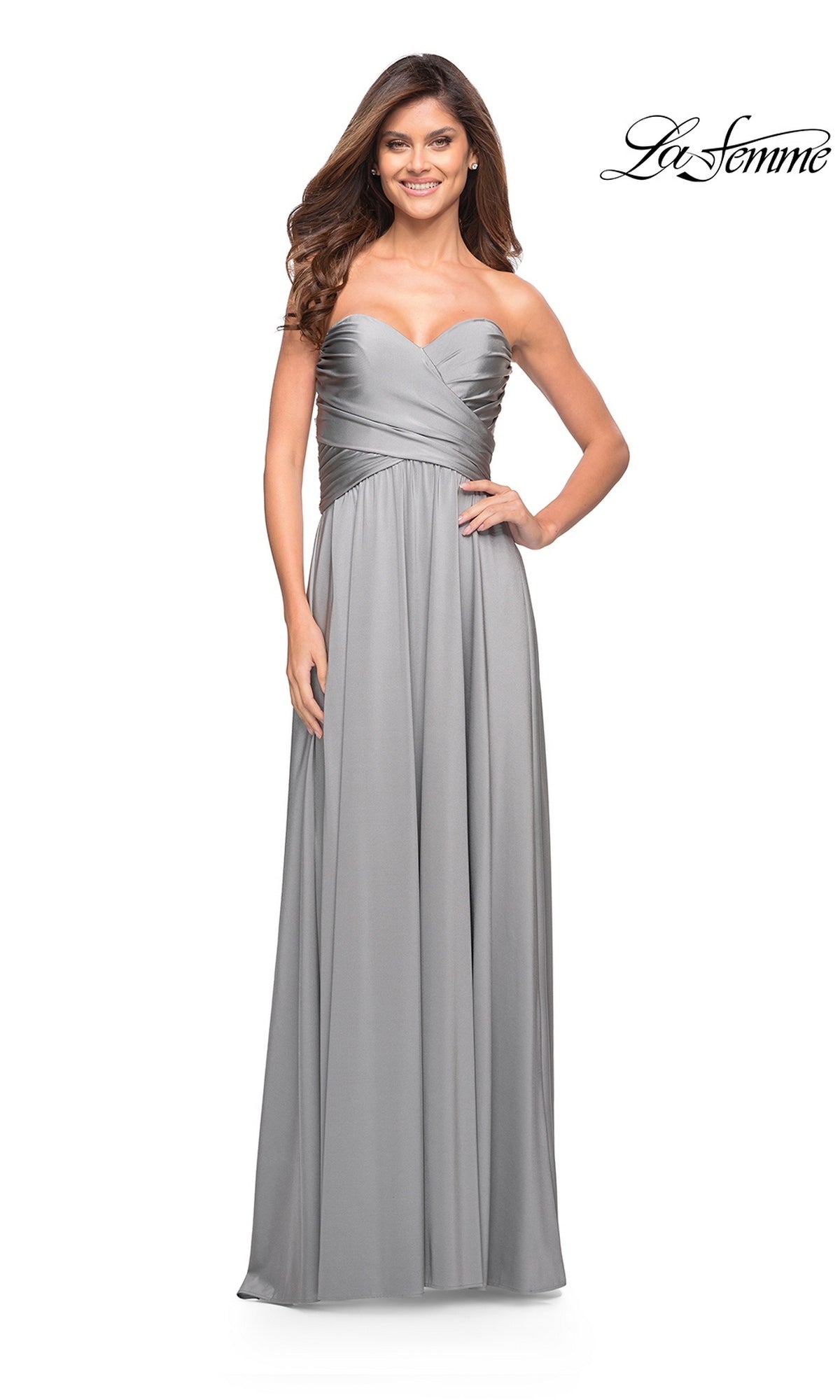 Woman in a silver Long Prom Dress: La Femme 30700 with sweetheart neckline and high-leg slit, smiling; “La Femme” logo in top right corner.