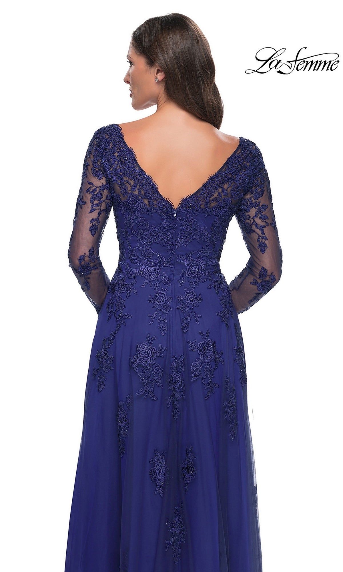La Femme 30795 is a long, dark blue formal gown with a V-neckline, long beaded lace sleeves, and floral embroidery across the bodice and A-line skirt.