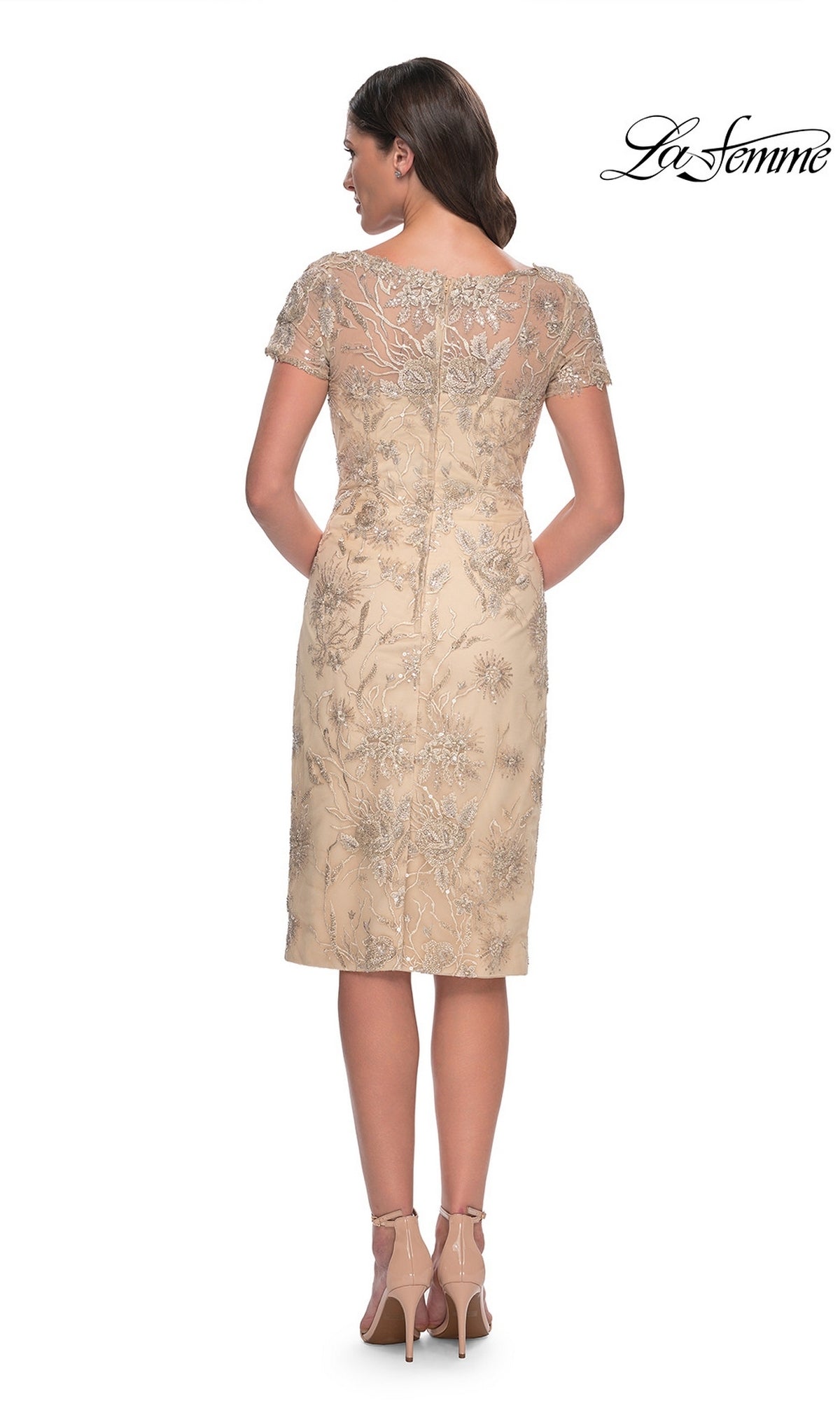 Back view of the Knee Length Wedding Guest Dress: La Femme 30801, a champagne dress with short sleeves and floral lace applique, worn with nude ankle-strap heels.