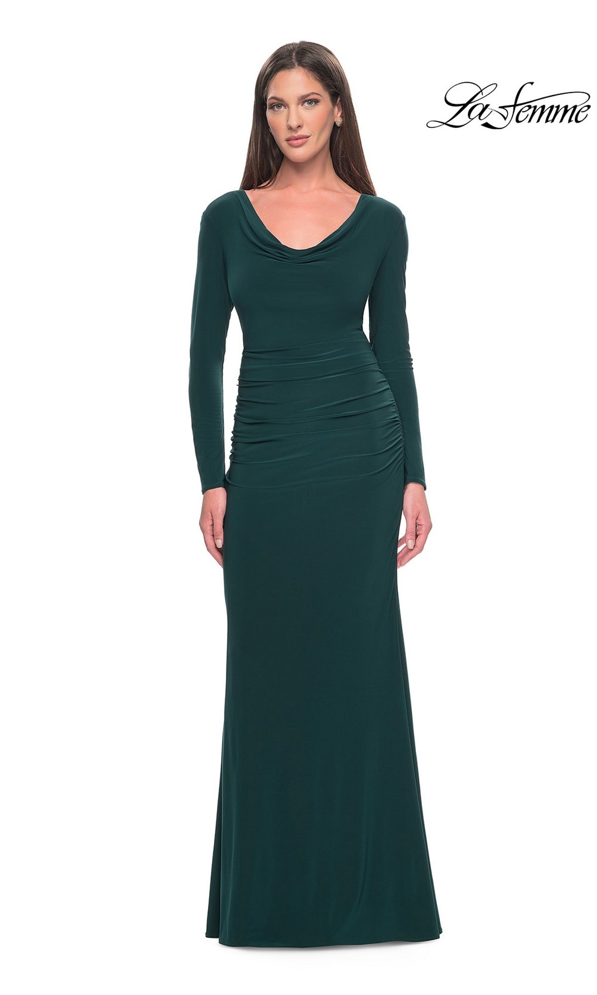 A woman wears the hunter green La Femme 30813, a long-sleeve, floor-length formal gown with a cowl neck, ruched waist, and modest silhouette.