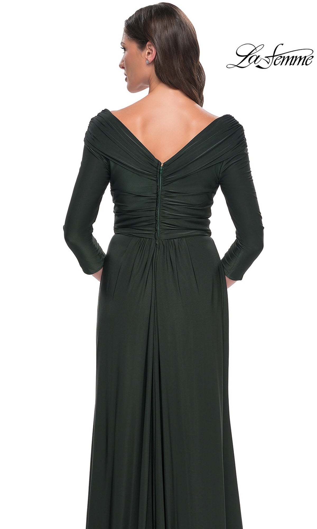 Back view of a woman in a dark green La Femme 30845 long formal dress, featuring a three-quarter sleeve design with a ruched off-the-shoulder neckline.