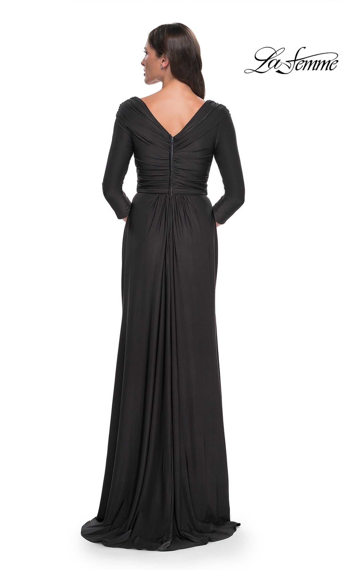 Back view of a woman in a black, floor-length La Femme 30845 jersey formal dress featuring three-quarter sleeves, a V-neckline, and a center back zipper.