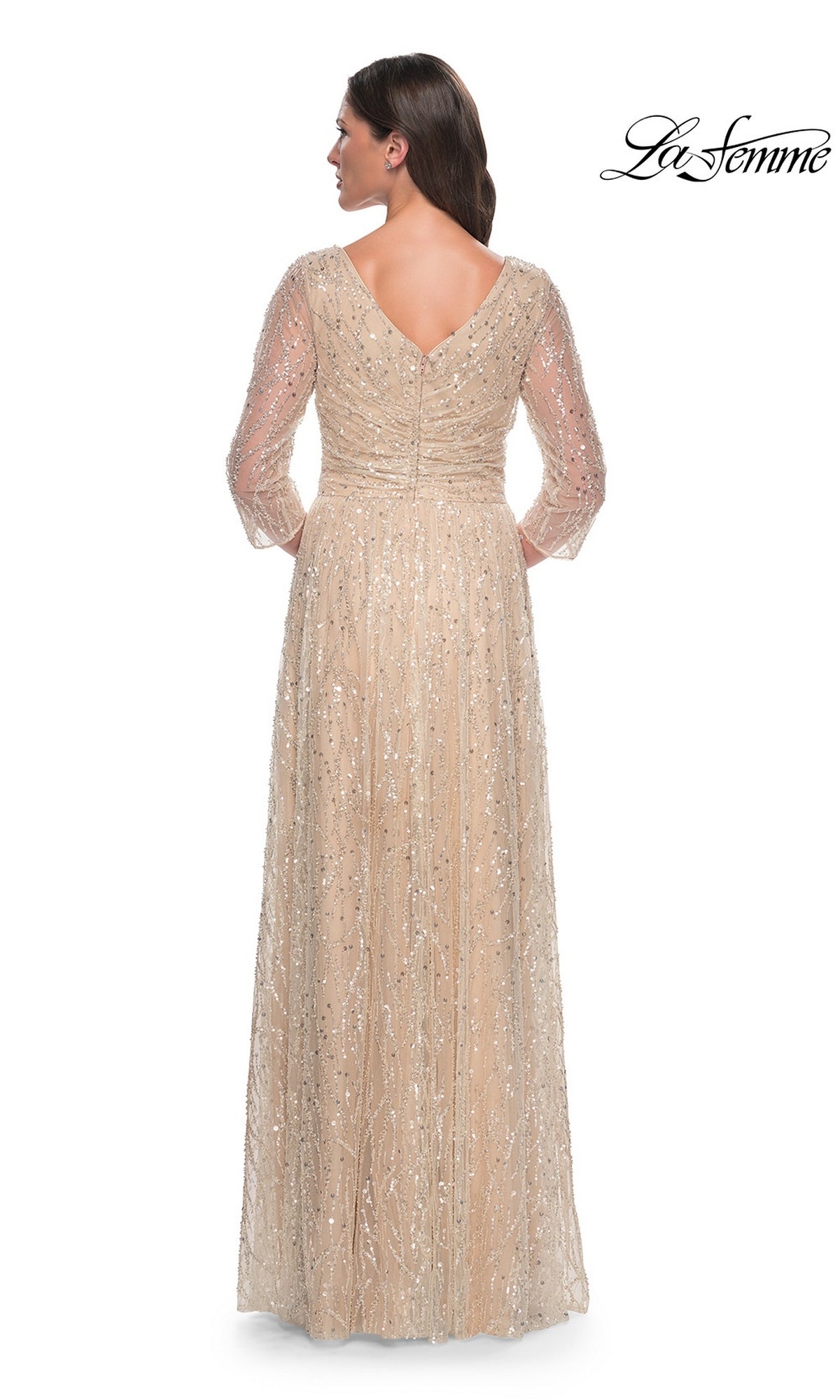 Back view of the floor-length, long-sleeved beige sequin La Femme 30911 evening gown.