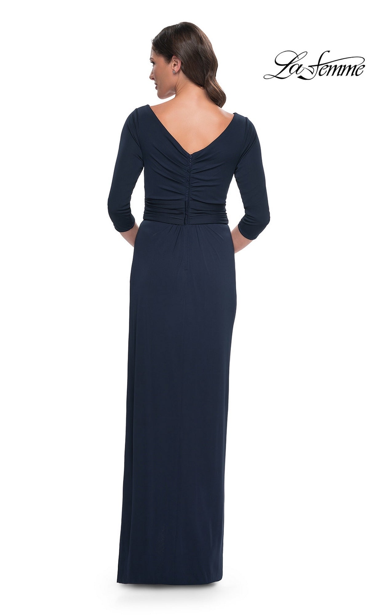 Back view of a woman in a Long Formal Dress: La Femme 31014, a long, dark navy jersey evening gown with a V-neckline and three-quarter length sleeves.