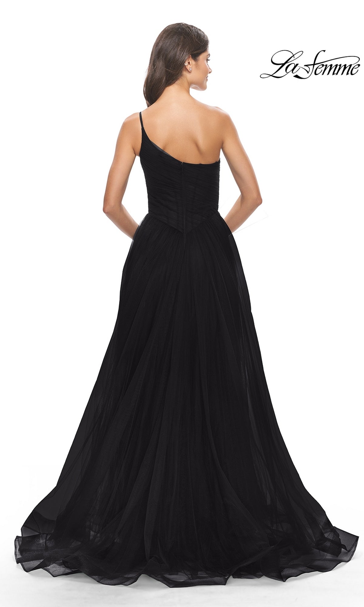 A woman with her back turned highlights the full skirt and fitted, sheer bodice of the One-Shoulder Sheer-Bodice Prom Ball Gown 31069. The La Femme logo is displayed in the top right corner.