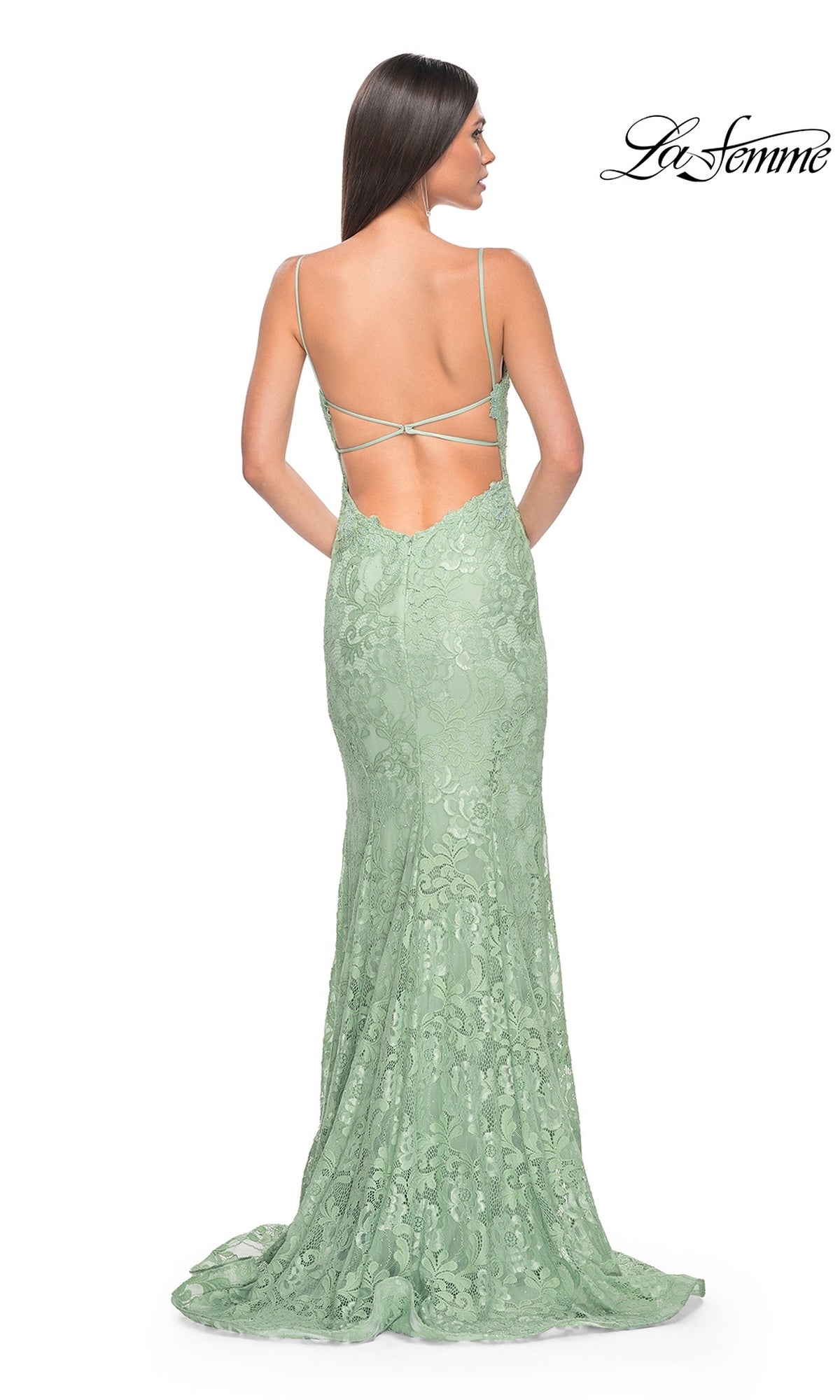 Woman in a floor-length mint green La Femme Long Floral-Lace Prom Dress 31134 with thin straps and an open back, standing against a white background.