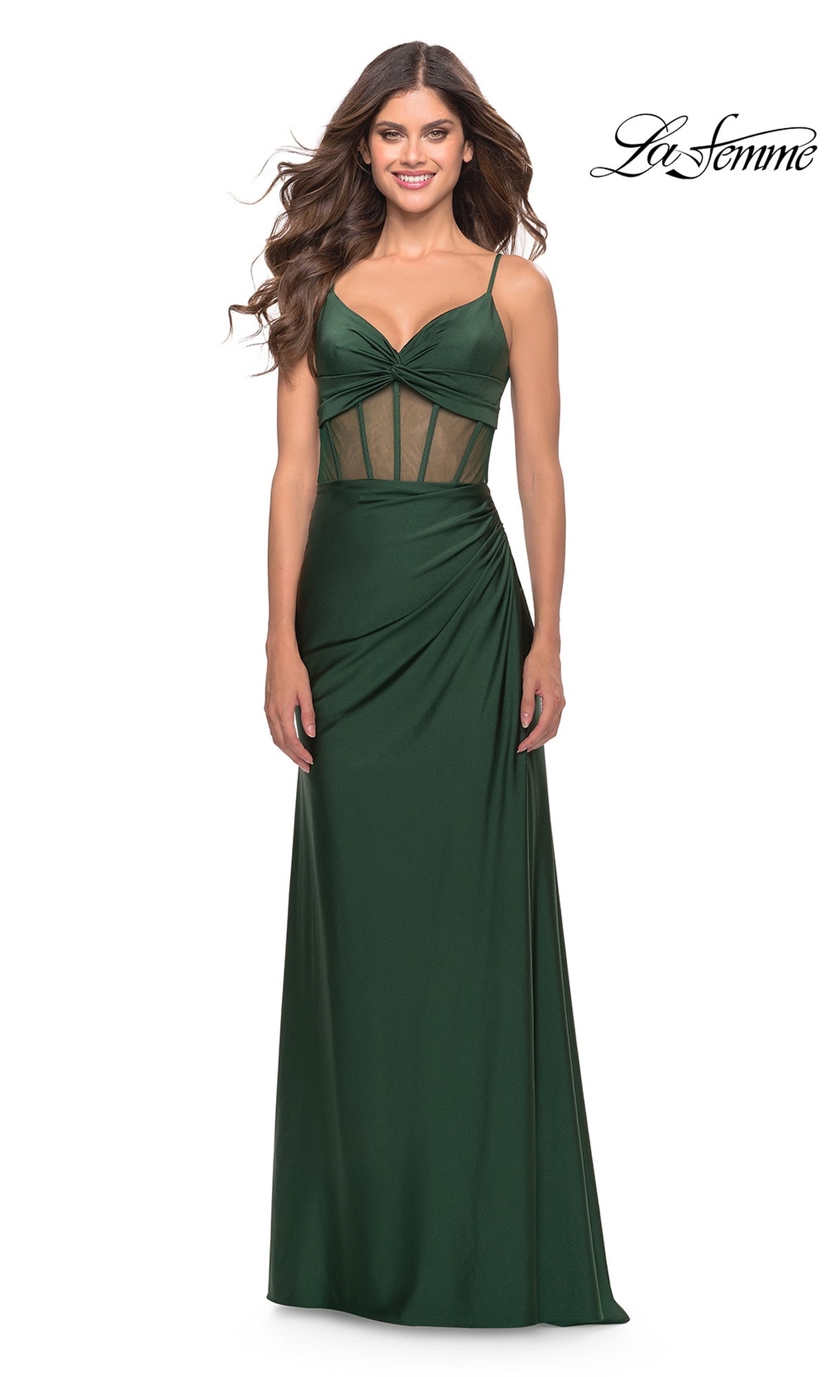 A woman wears the La Femme V-Neck Sheer-Corset Long Prom Dress 31229 in dark green with mesh side panels, a fitted bodice, and a floor-length skirt. The La Femme logo is displayed in the top right corner.