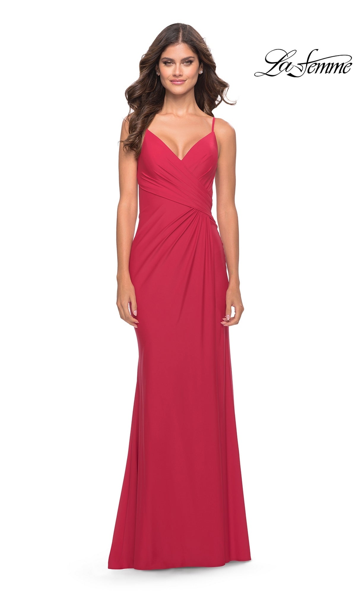 A model wearing the Long Prom Dress: La Femme 31331, a jersey gown featuring a V-neckline, gathered waist detail, and a high-leg slit.