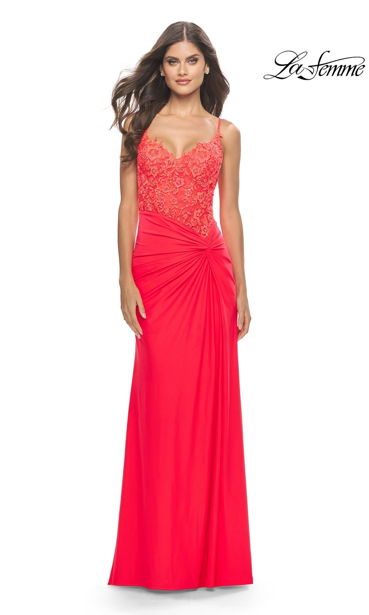 A woman wears the Sheer-Bodice Long Prom Dress: La Femme 31447, a sleeveless, floor-length red gown featuring an embroidered bodice, thin straps, and gathered waist detail. The