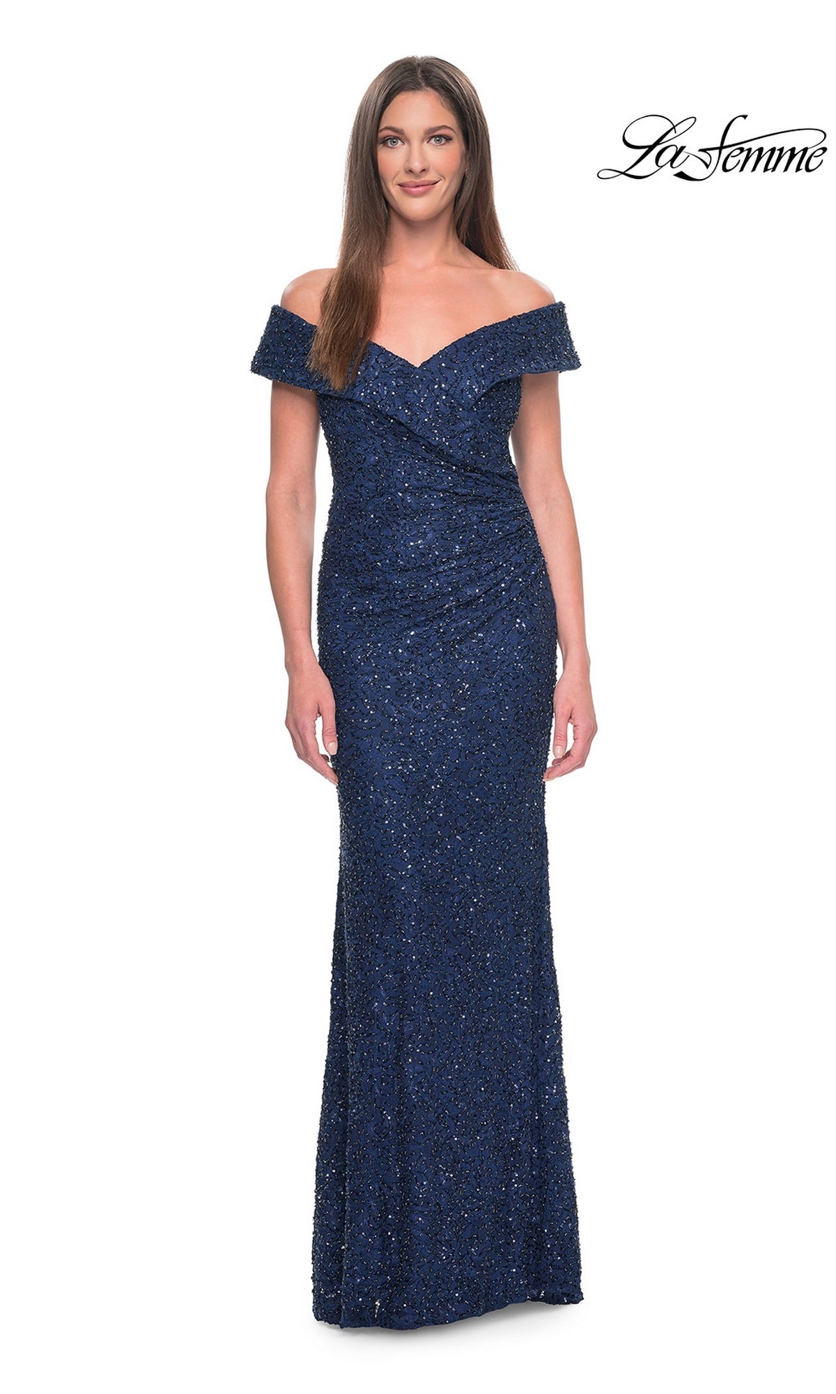 A woman wears a navy, off-the-shoulder, floor-length sequined evening gown made of beaded lace, identified as the Long Formal Dress: La Femme 31679.
