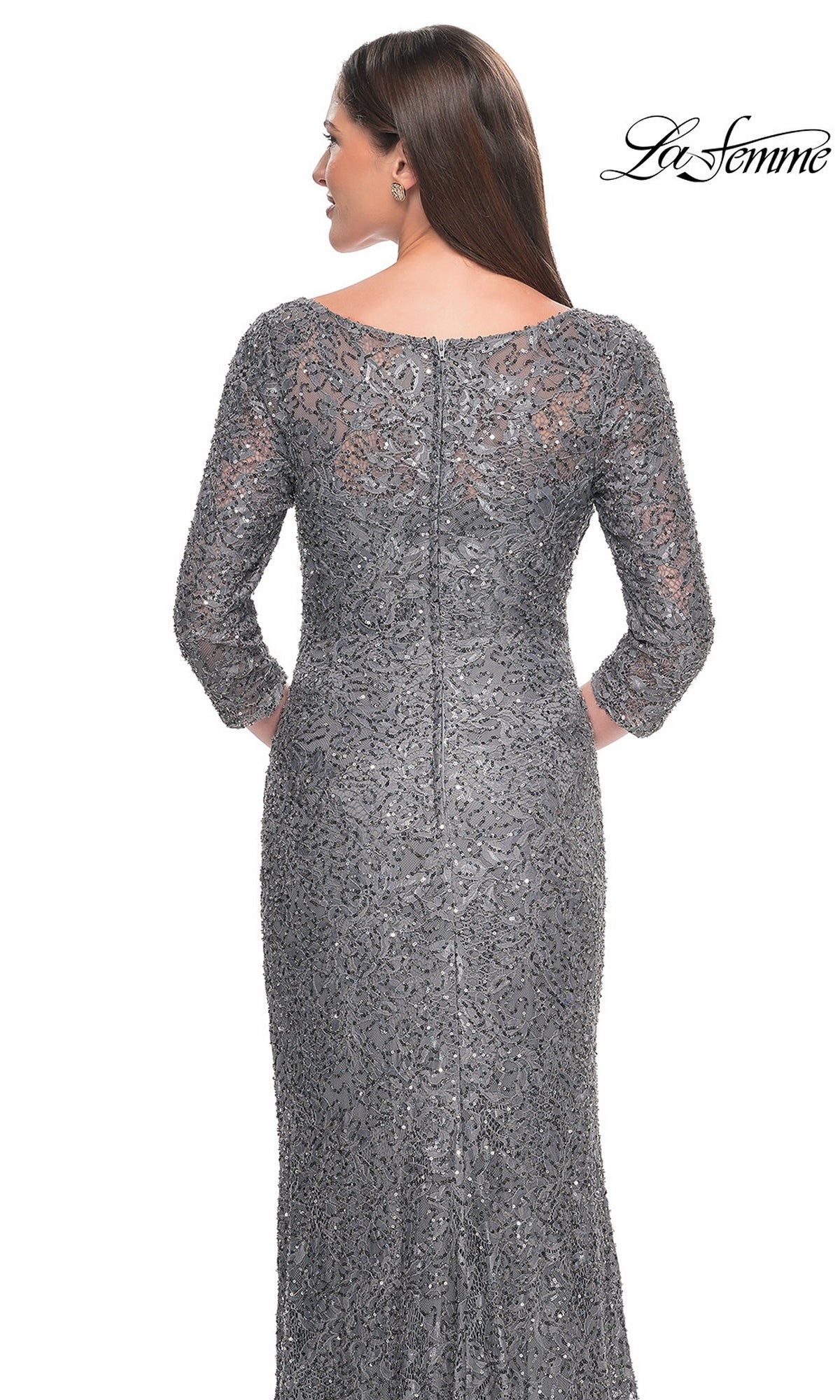 Back view of a woman wearing a La Femme 31721 floor-length, gray, sequined lace formal dress with three-quarter sleeves and a boat neckline.