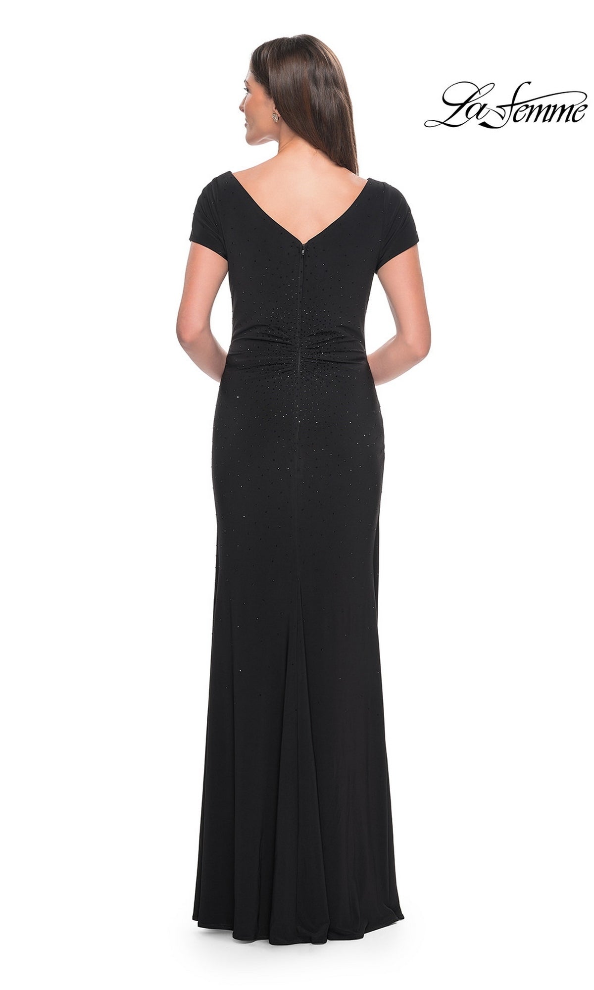 Back view of the black La Femme 31773 jersey formal dress featuring short sleeves, a v-neckline, and scattered rhinestone embellishments.