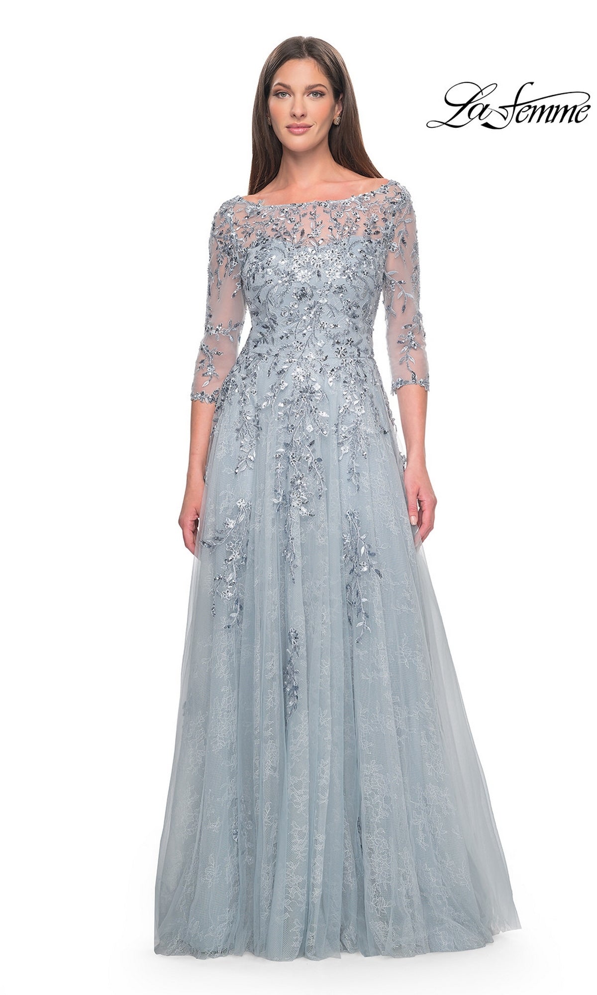 La Femme 31795 is a floor-length dusty blue formal dress with three-quarter sleeves, a boat neckline, and intricate silver floral embroidery on beaded tulle.
