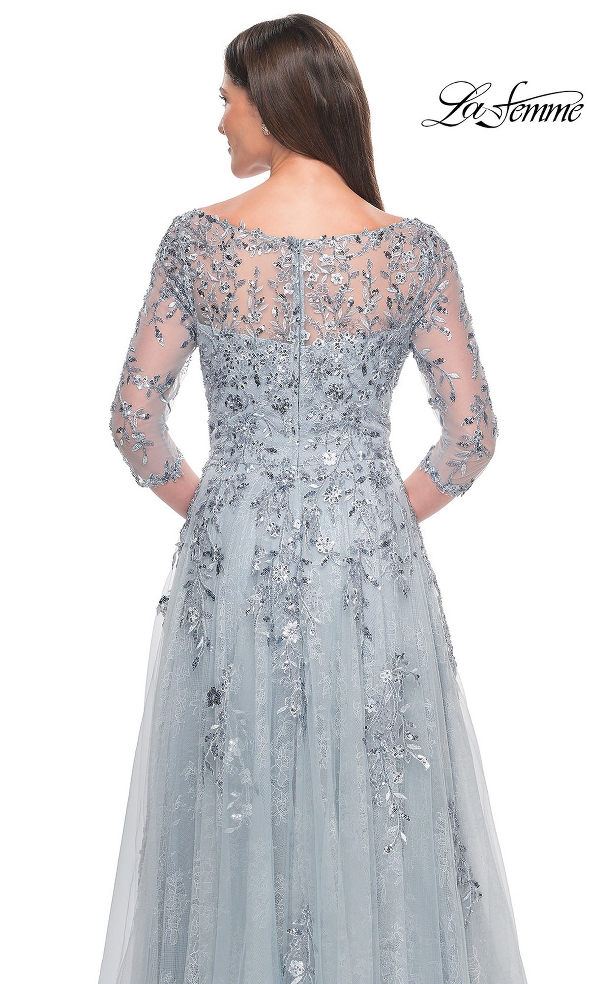 Back view of the Long Formal Dress: La Femme 31795, a light gray mother-of-the-bride dress with a boat neckline, three-quarter sleeves, and intricate silver floral embroidery and sequins on beaded tulle.