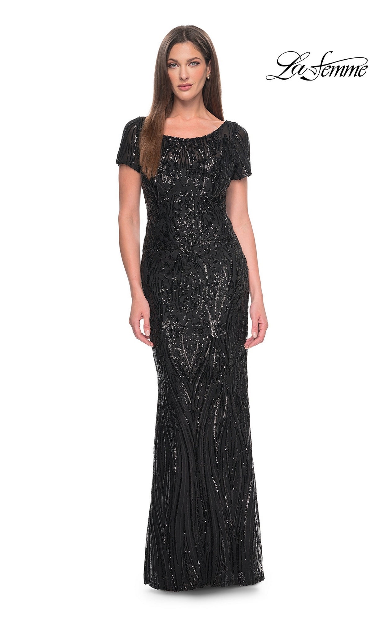 A model wearing a Long Formal Dress: La Femme 31852, a floor-length black sequin dress with short sleeves and a scoop neckline.