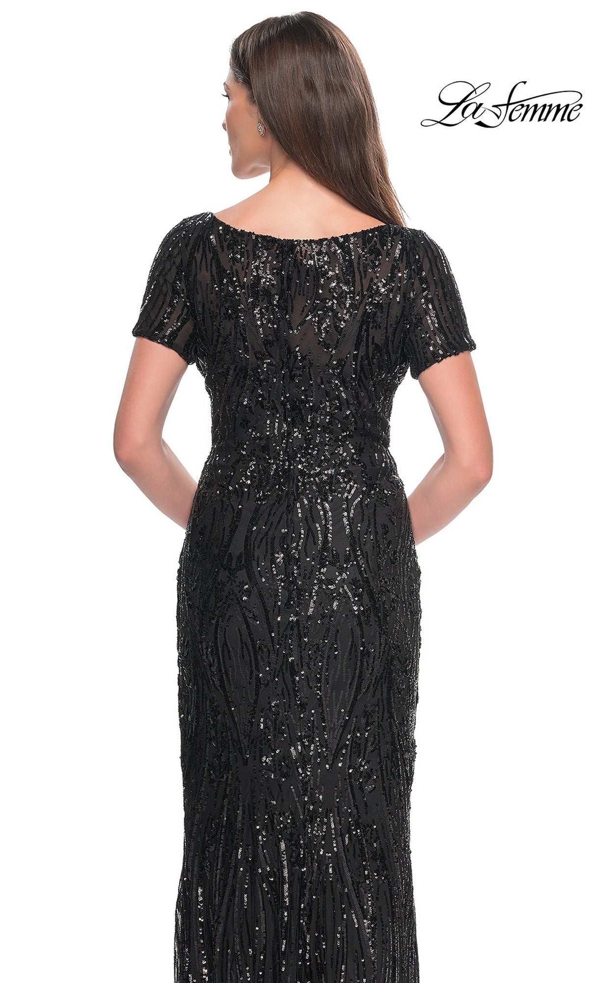 Back view of a woman wearing a black short-sleeved, floor-length La Femme 31852 sequin formal dress with vertical patterns.