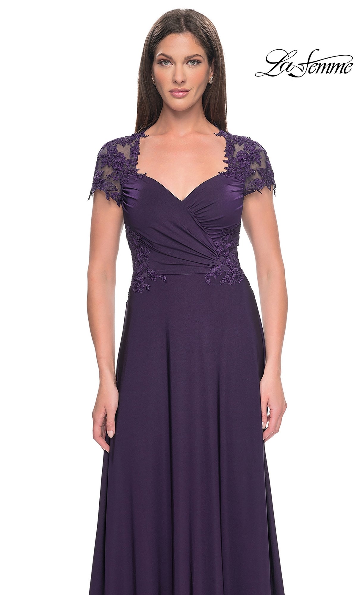 Woman wearing the La Femme Cap Sleeve Long Purple Prom Dress 31906, a floor-length gown in deep eggplant with lace details on the shoulders and bodice, standing against a white background.