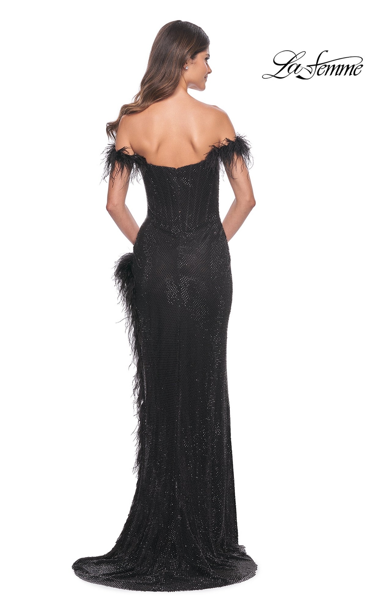 A woman faces away in the Feather-Trim La Femme Long Black Prom Dress 32151, an off-shoulder, floor-length gown with feathered trim;