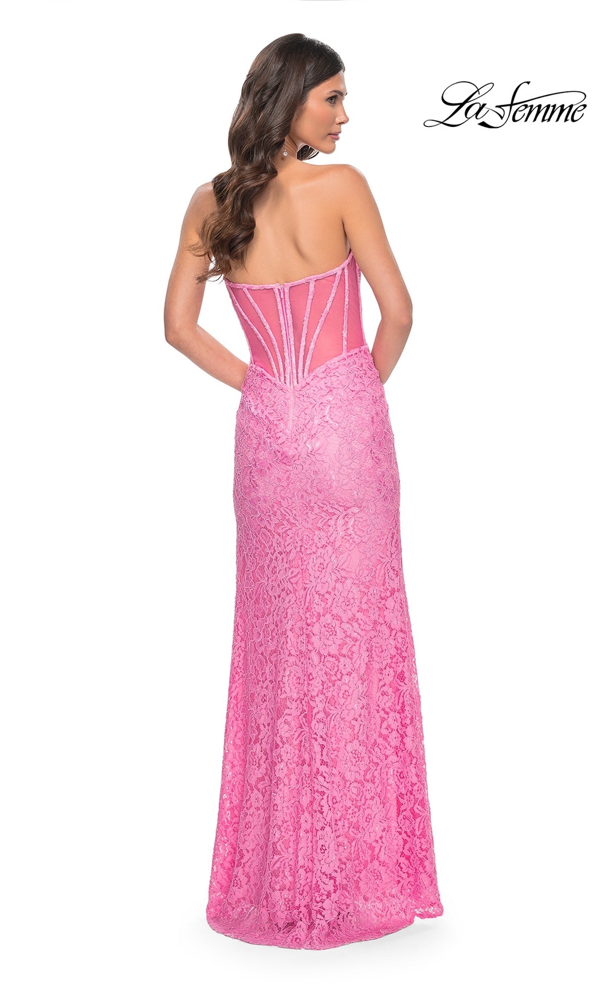 A woman is shown from the back wearing the La Femme Strapless Long Lace Prom Dress 32298, featuring a floor-length pink lace design with a sheer, structured bodice. The La Femme logo appears in the top right corner.