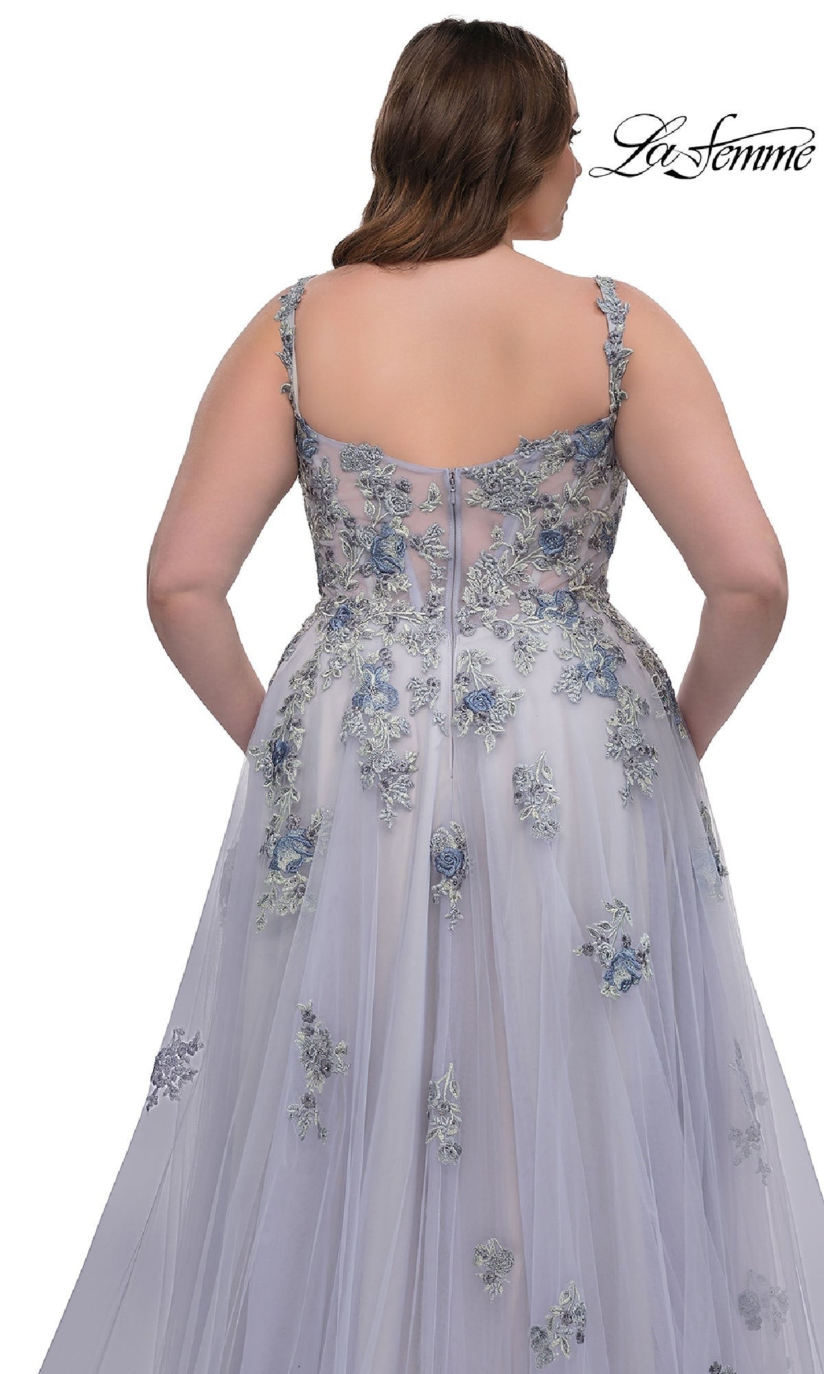 Woman wearing the La Femme 32412 long plus-size prom ball gown, featuring a sleeveless design, blue floral lace embroidery, and an elegant corset bodice, shown from the back against a white background.