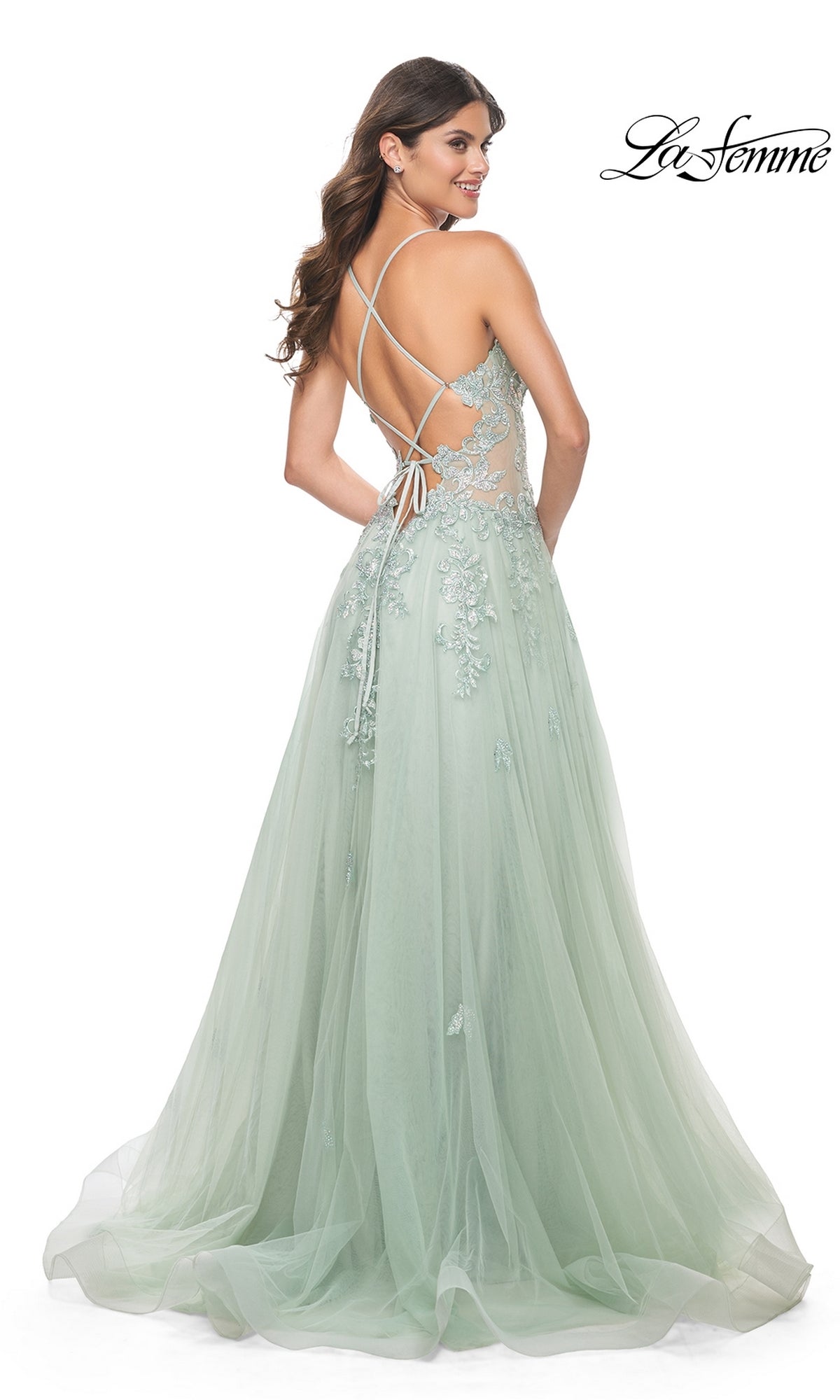 Model wears the Sheer-Waist Long A-Line Prom Dress (La Femme 32438) in mint green, featuring lace appliqué, a tulle skirt, and a crisscross open back. The La Femme logo is displayed in the top right corner.