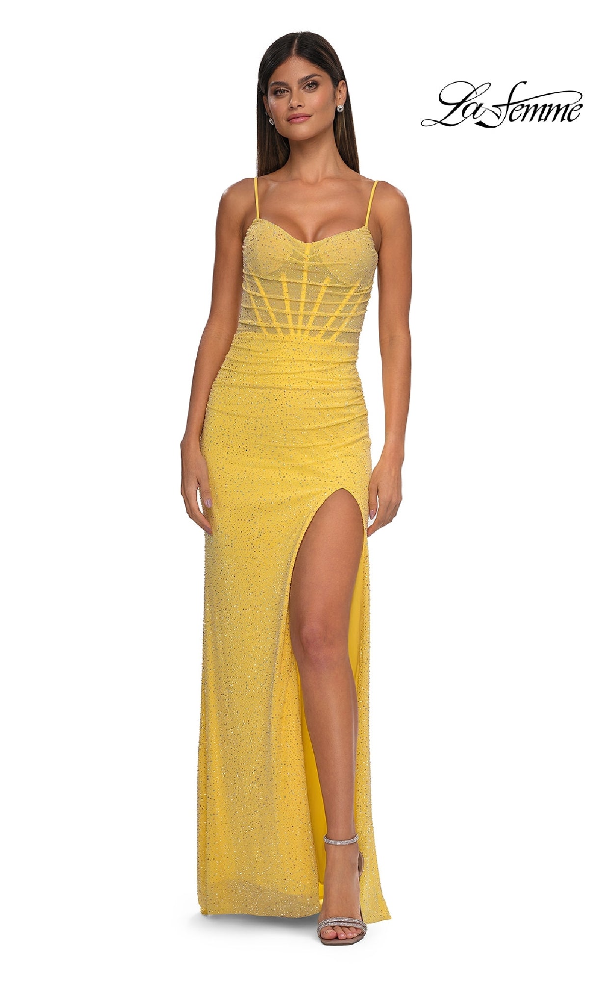 A woman models the yellow Long Beaded Prom Dress: La Femme 32578, featuring a floor-length design and thigh-high slit, set against a white background with the La Femme logo in the top right corner.