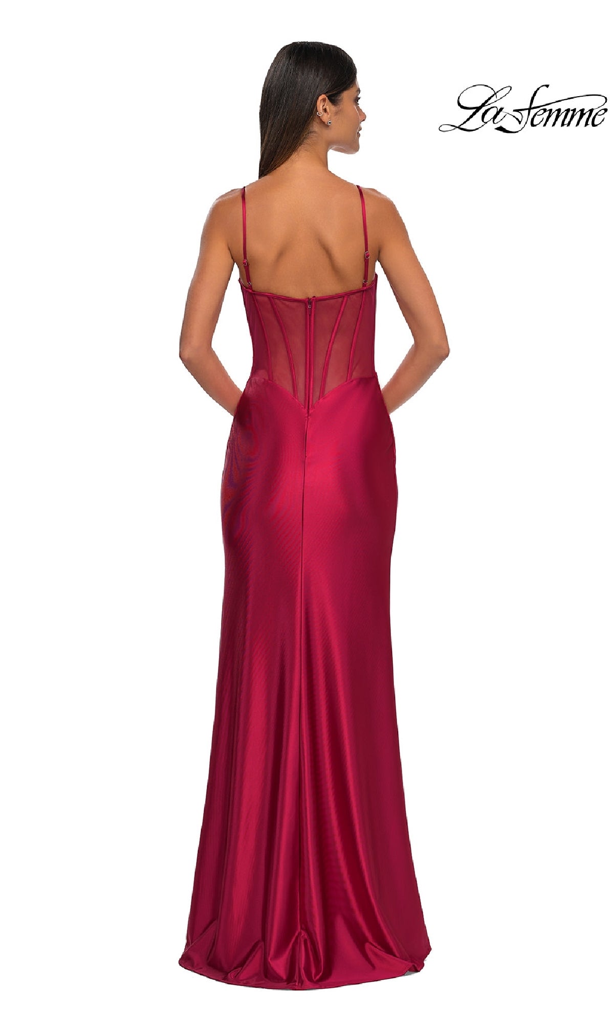 Woman wearing Sheer-Back Simple Long Prom Dress La Femme 32640 with thin straps, fitted satin silhouette, and a sheer corset back; shown from behind.
