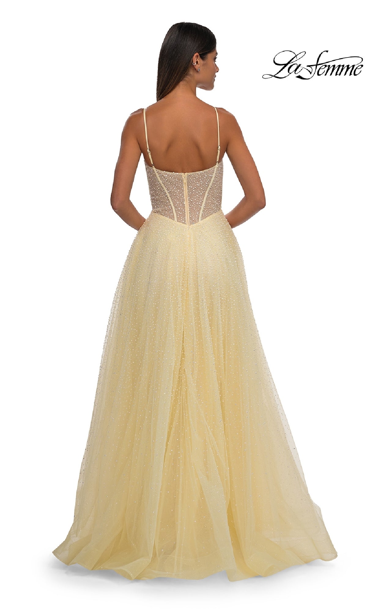 A woman is shown from the back wearing the Pearl Classic Long Prom Dress: La Femme 32644, a light yellow, pearl-beaded prom dress with spaghetti straps and a sheer bodice. The La Femme logo is in the top right corner.