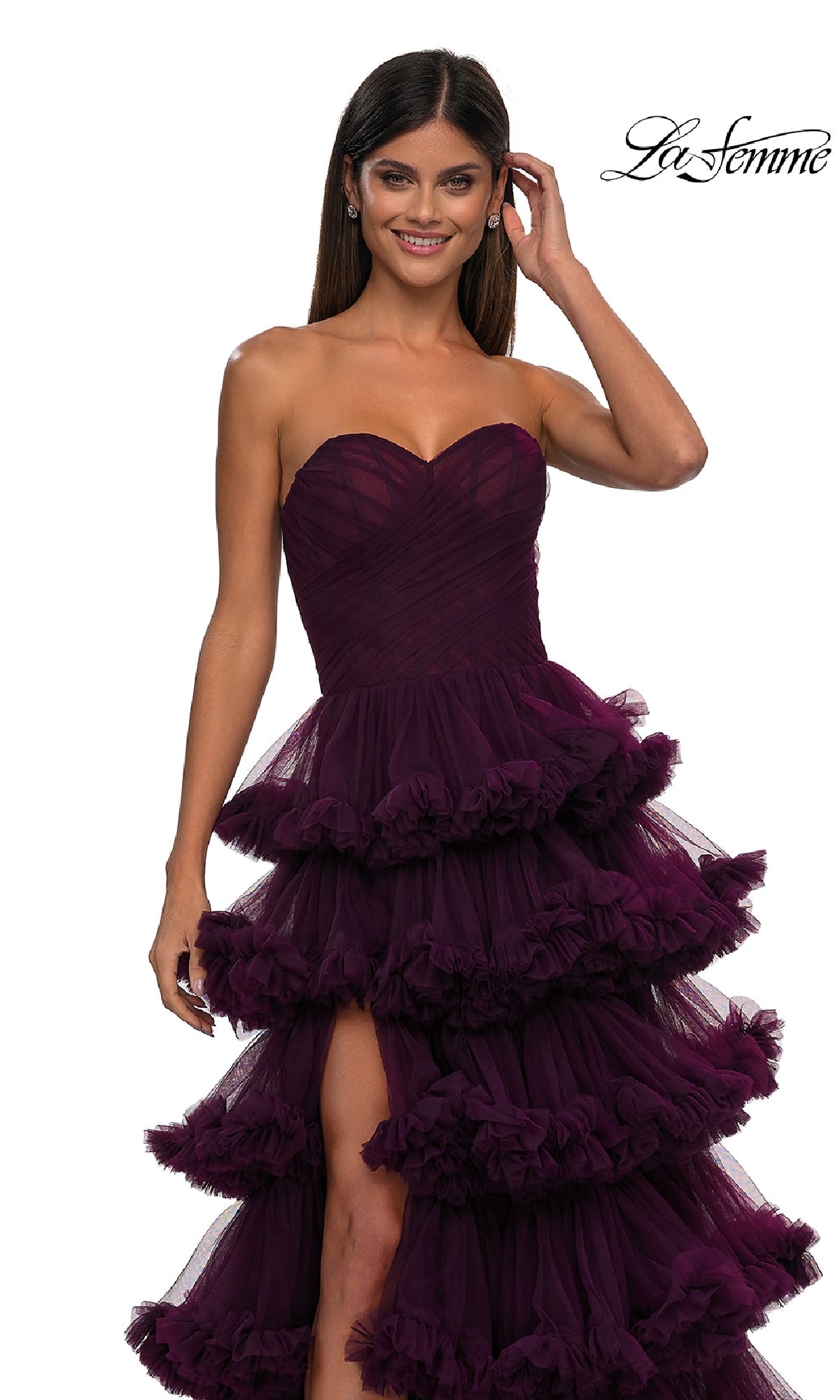A woman in the striking Strapless Ruffled Prom Ball Gown, La Femme 32721, makes a statement.